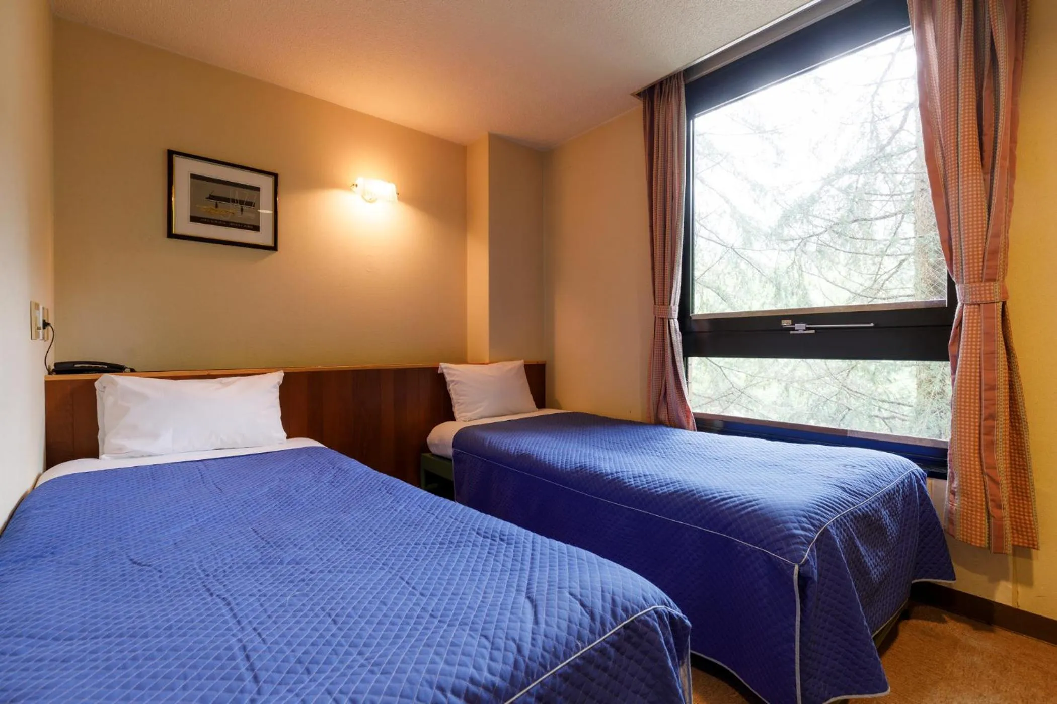 Bed in ホテルにれの樹