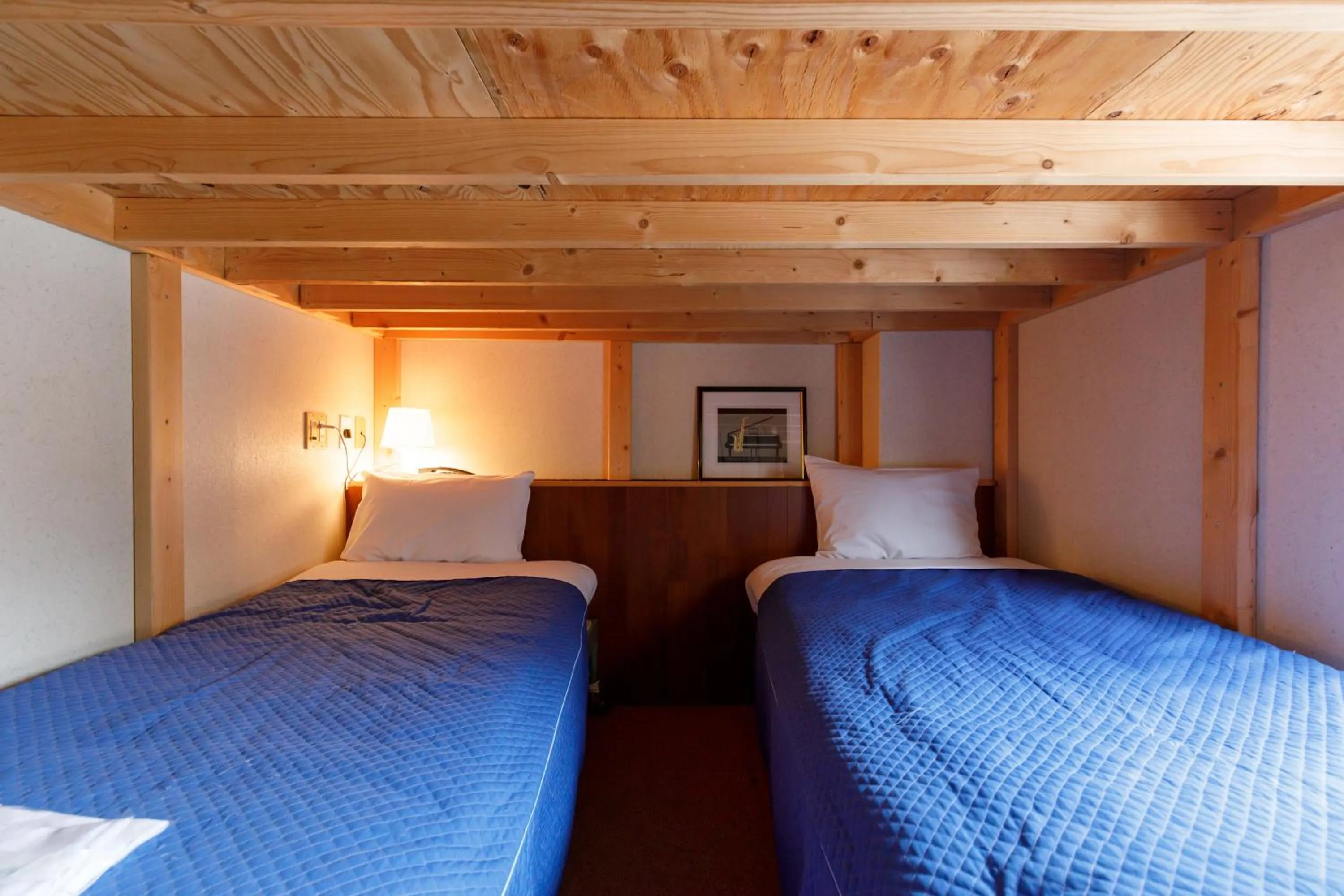 Bed in ホテルにれの樹