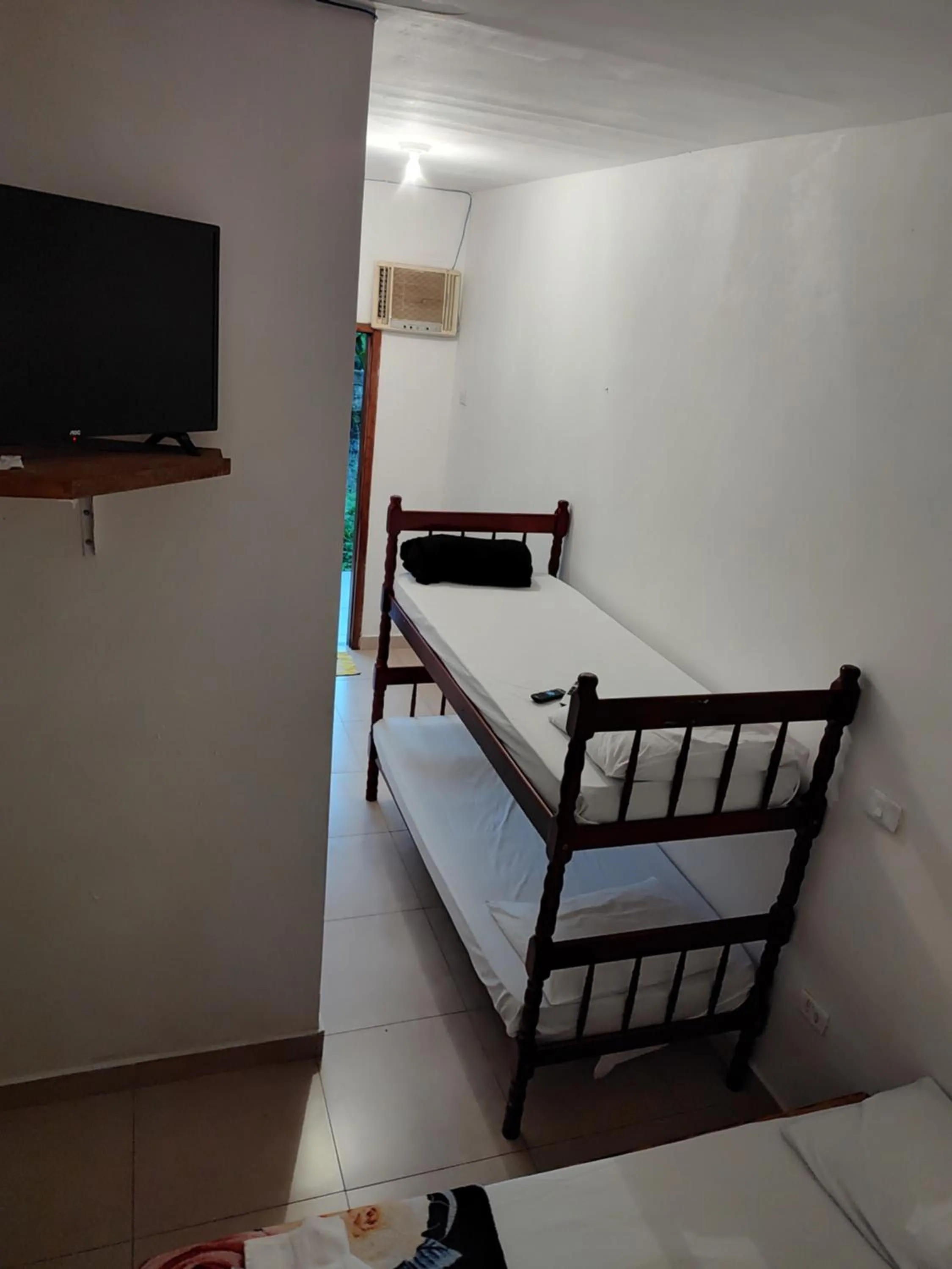Communal lounge/ TV room, Bed in Pousada Rancho Texas Ubatuba