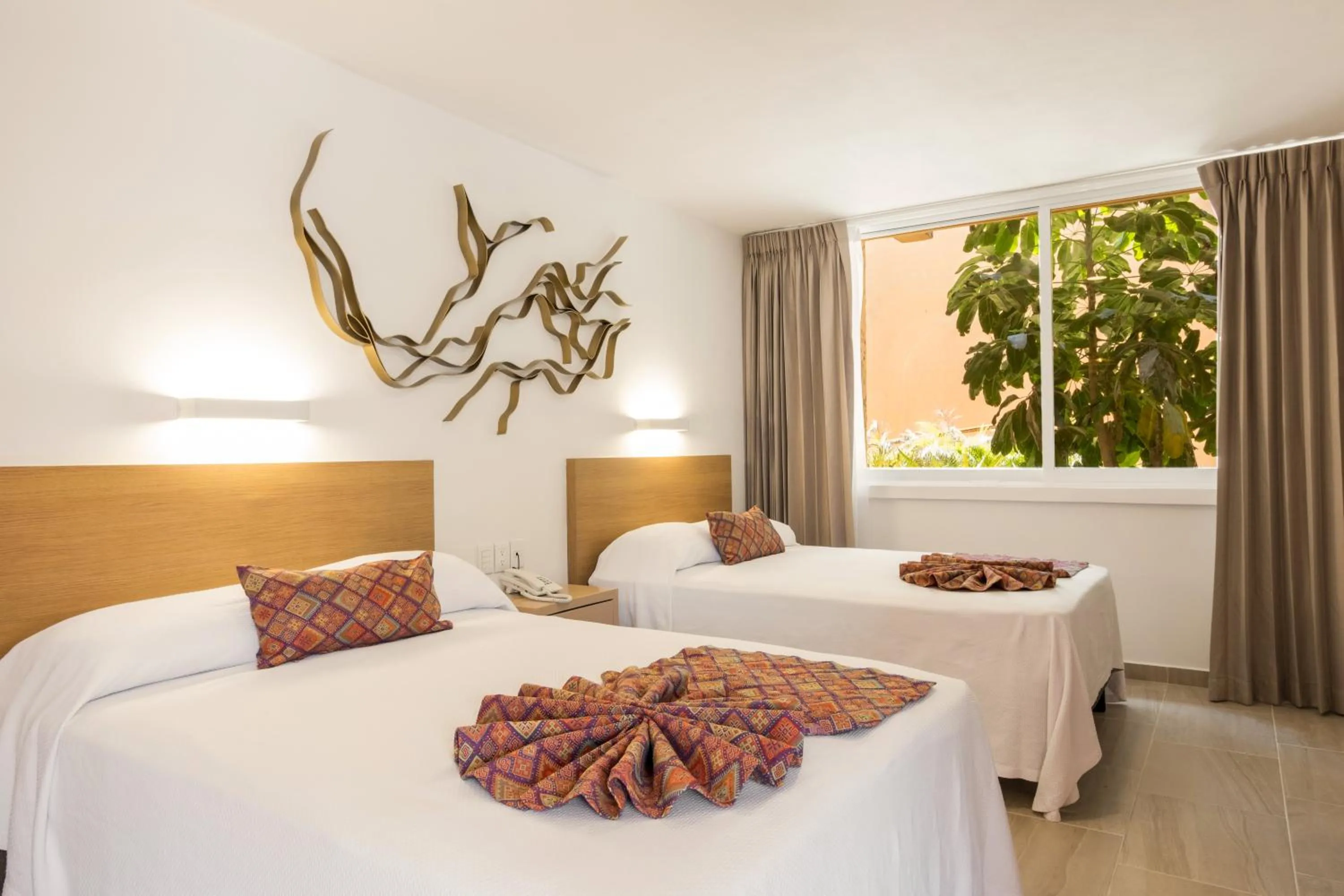 Bed in Costa de Oro Beach Hotel