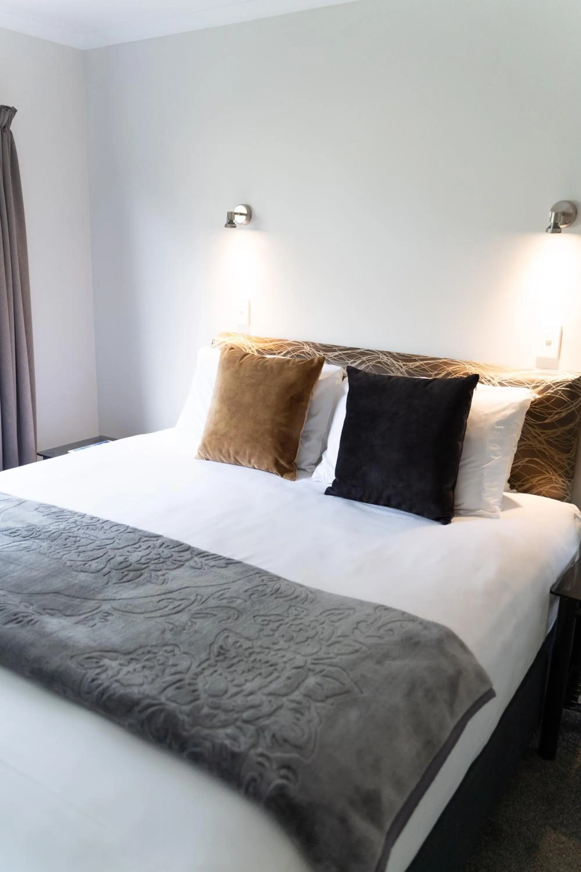 Bed in Pacific Coast Motor Lodge