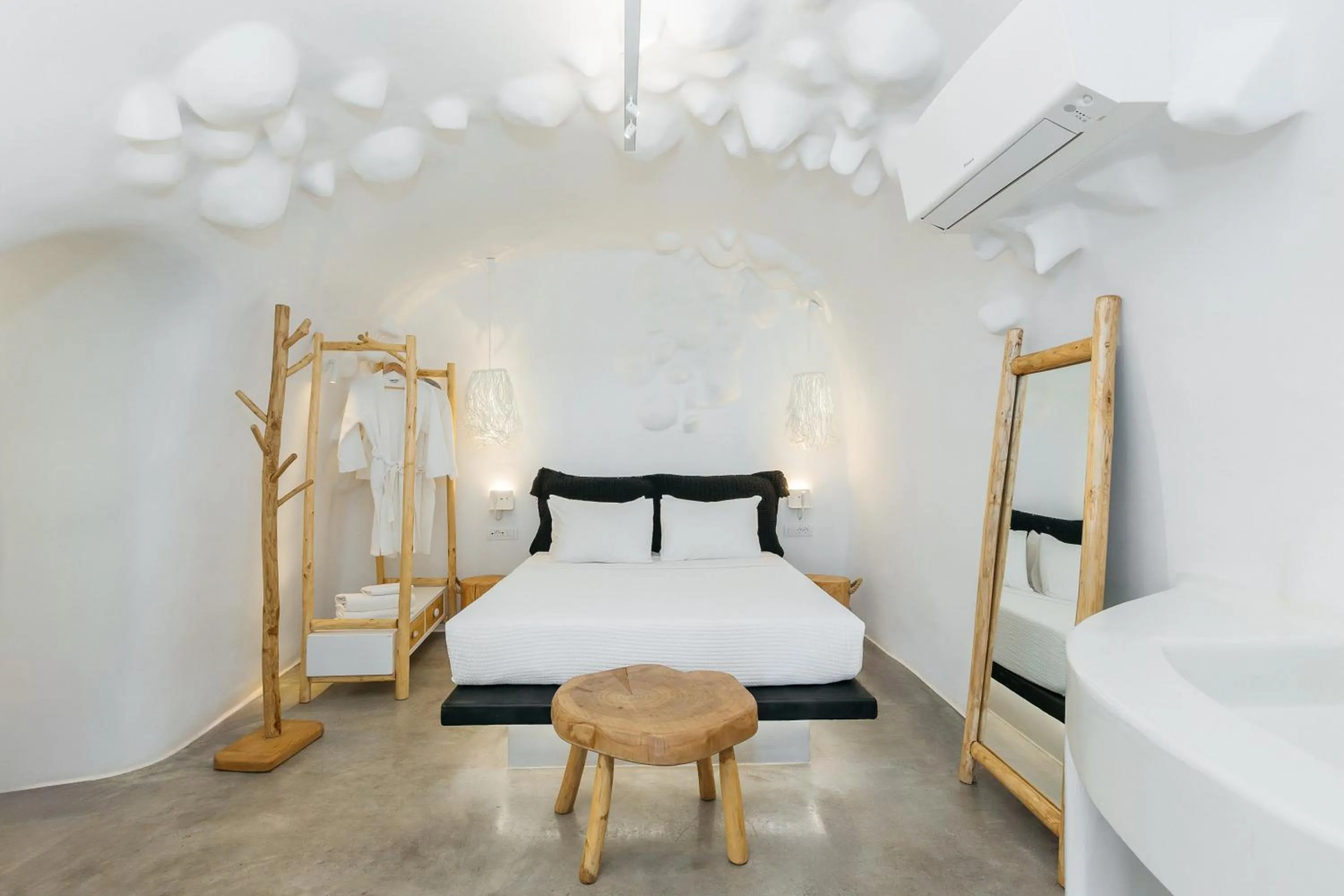 Bed in Theano Cave Suites & Villas