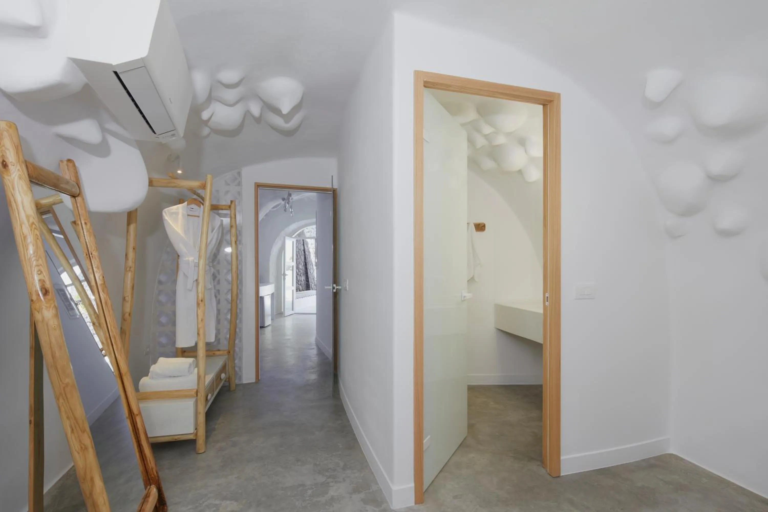 Bed in Theano Cave Suites & Villas