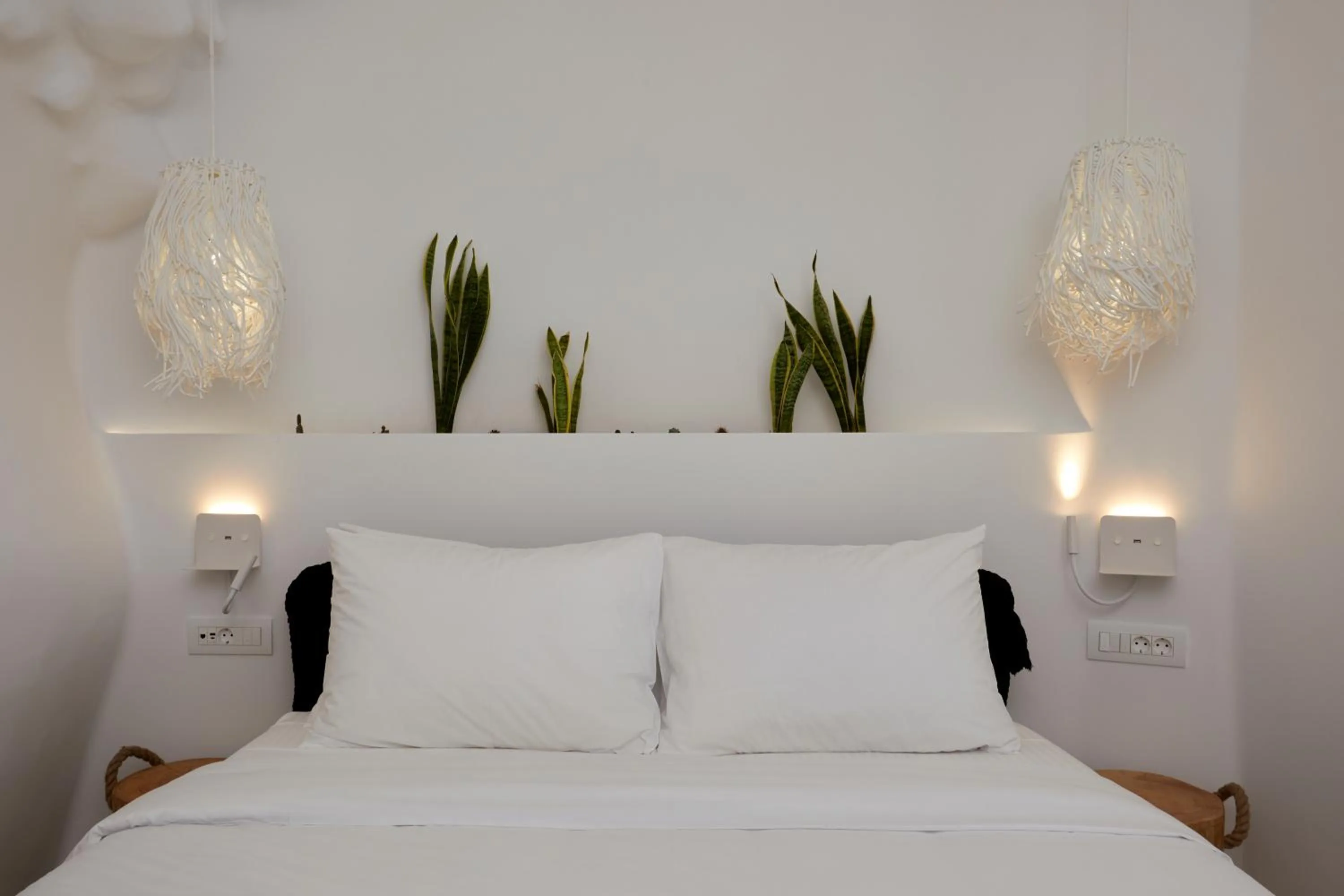 Bed in Theano Cave Suites & Villas