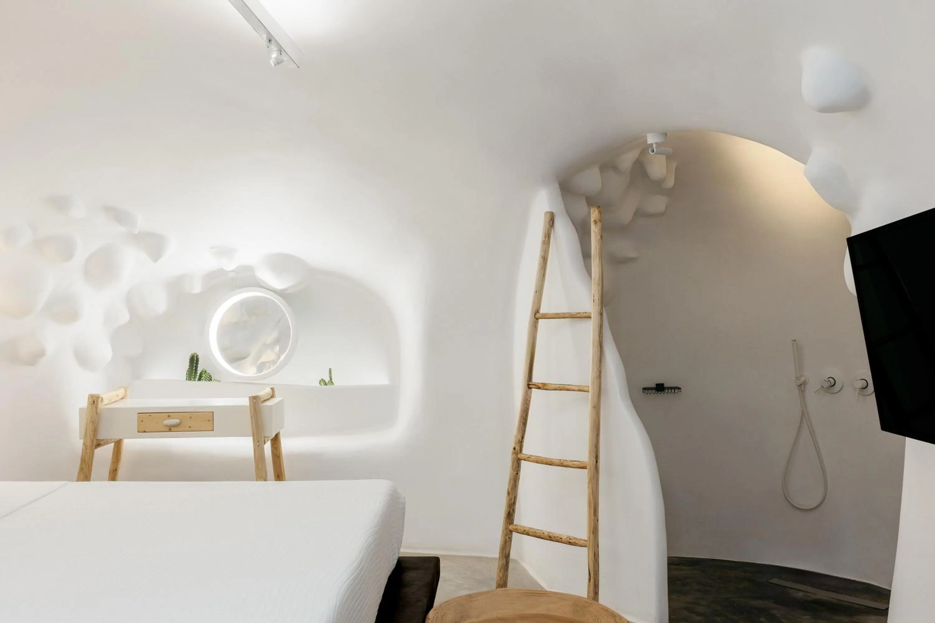 Bed in Theano Cave Suites & Villas