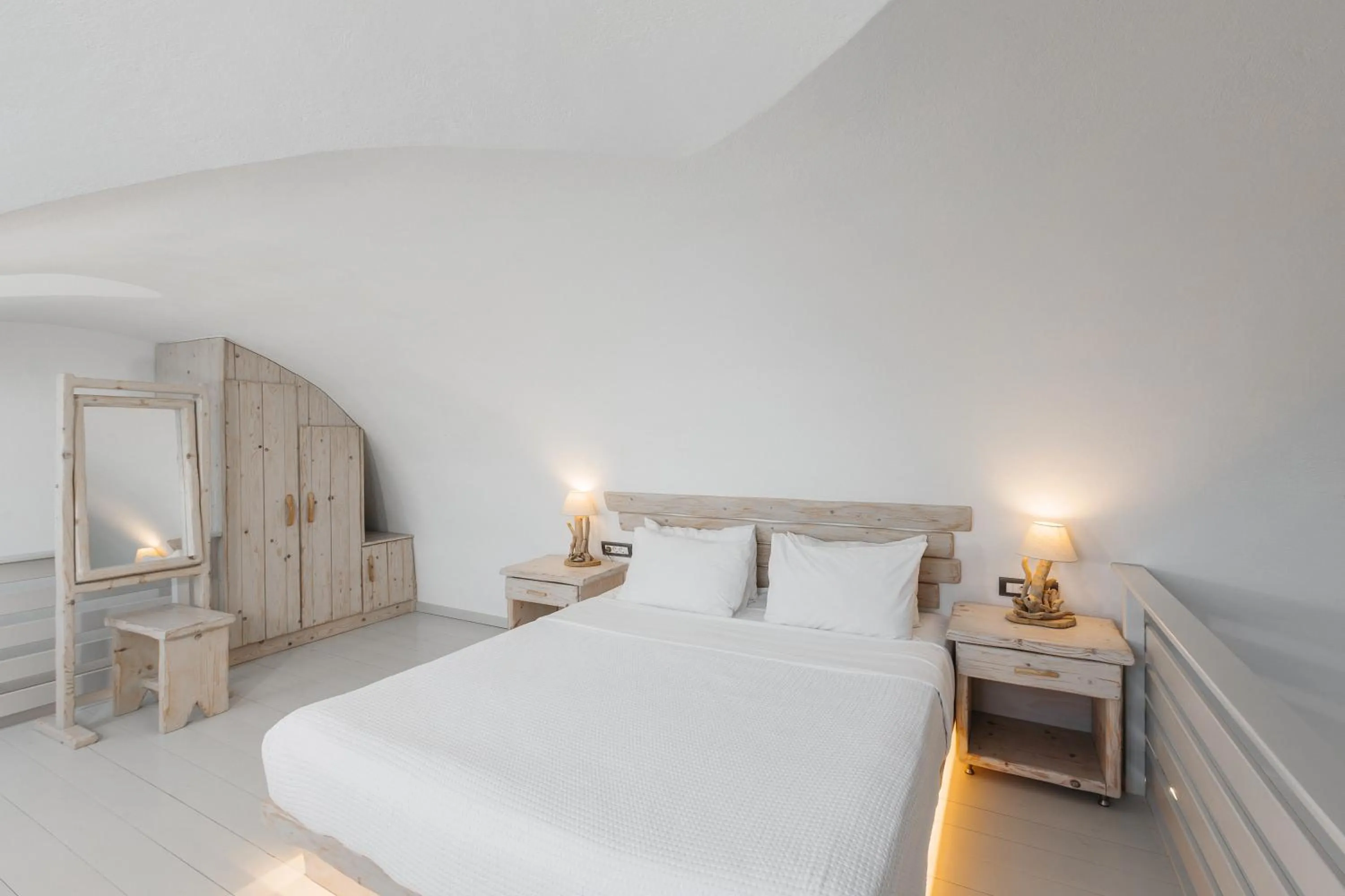 Bed in Theano Cave Suites & Villas