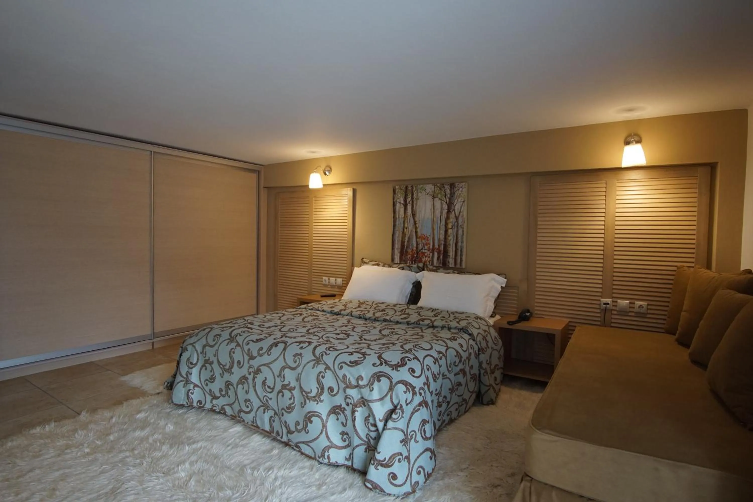 Bed in Forest Suites Boutique Hotel