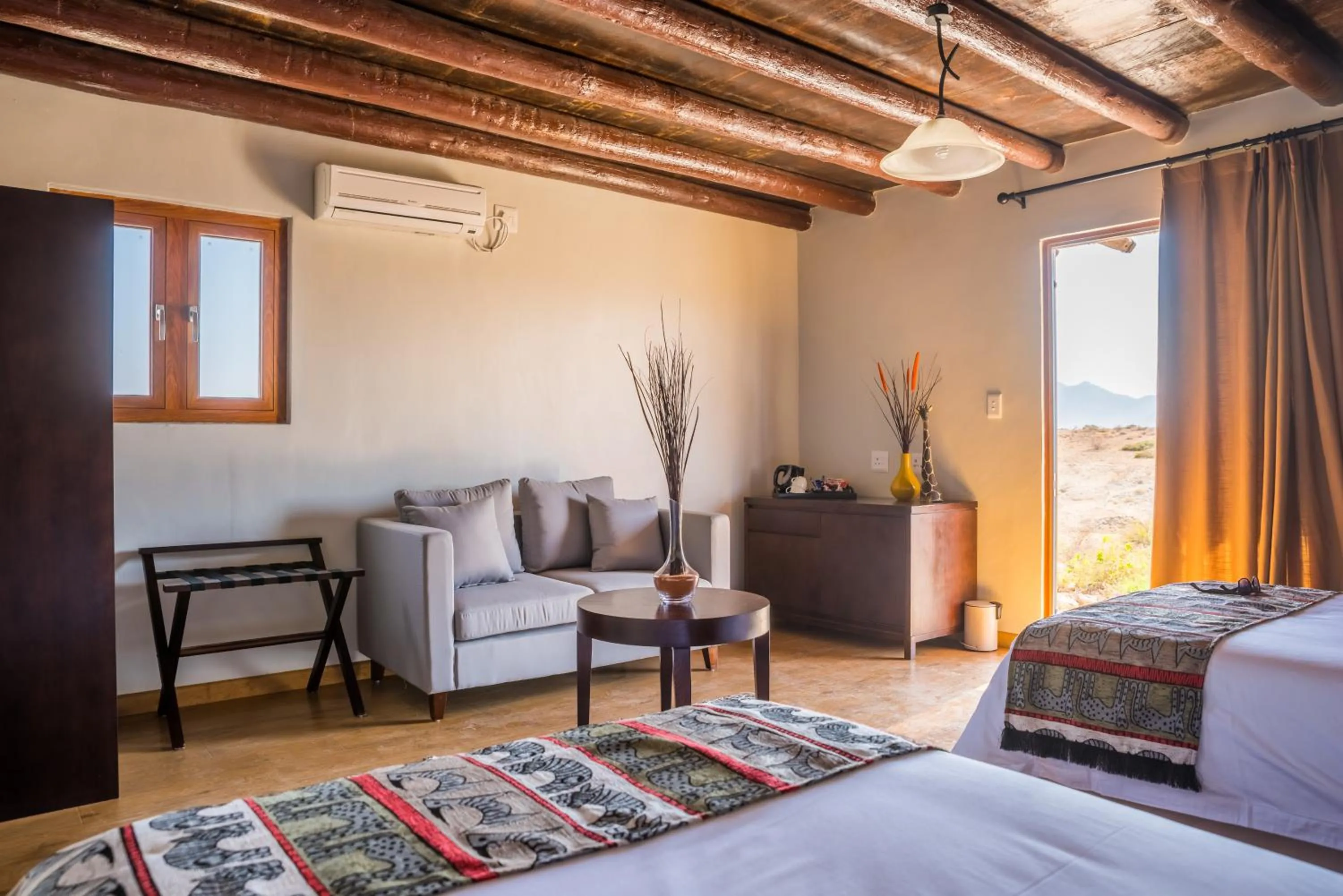 Seating area, Bed in Agama Lodge