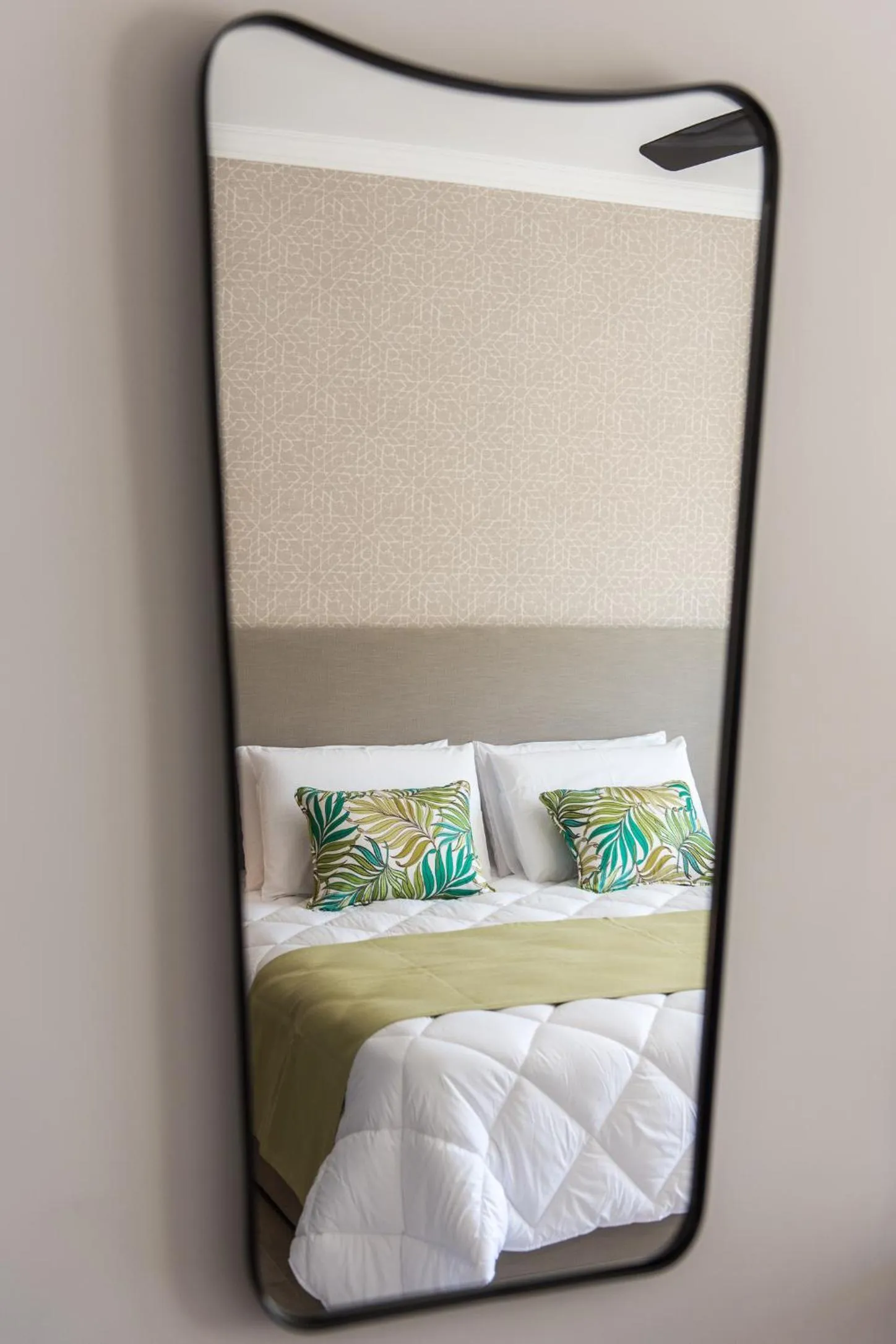 Bed in Cesca's Boutique Hotel