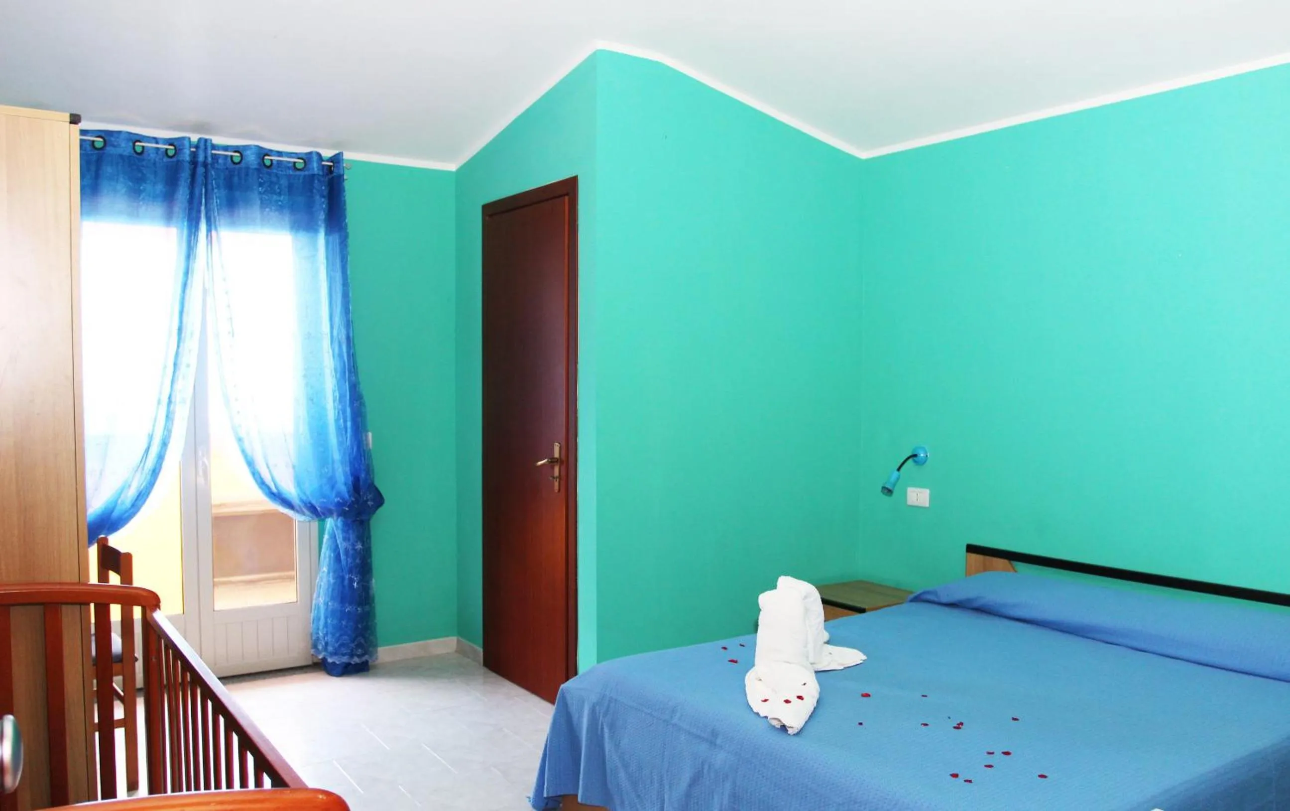 Bed in A Turri Rooms and Restaurant