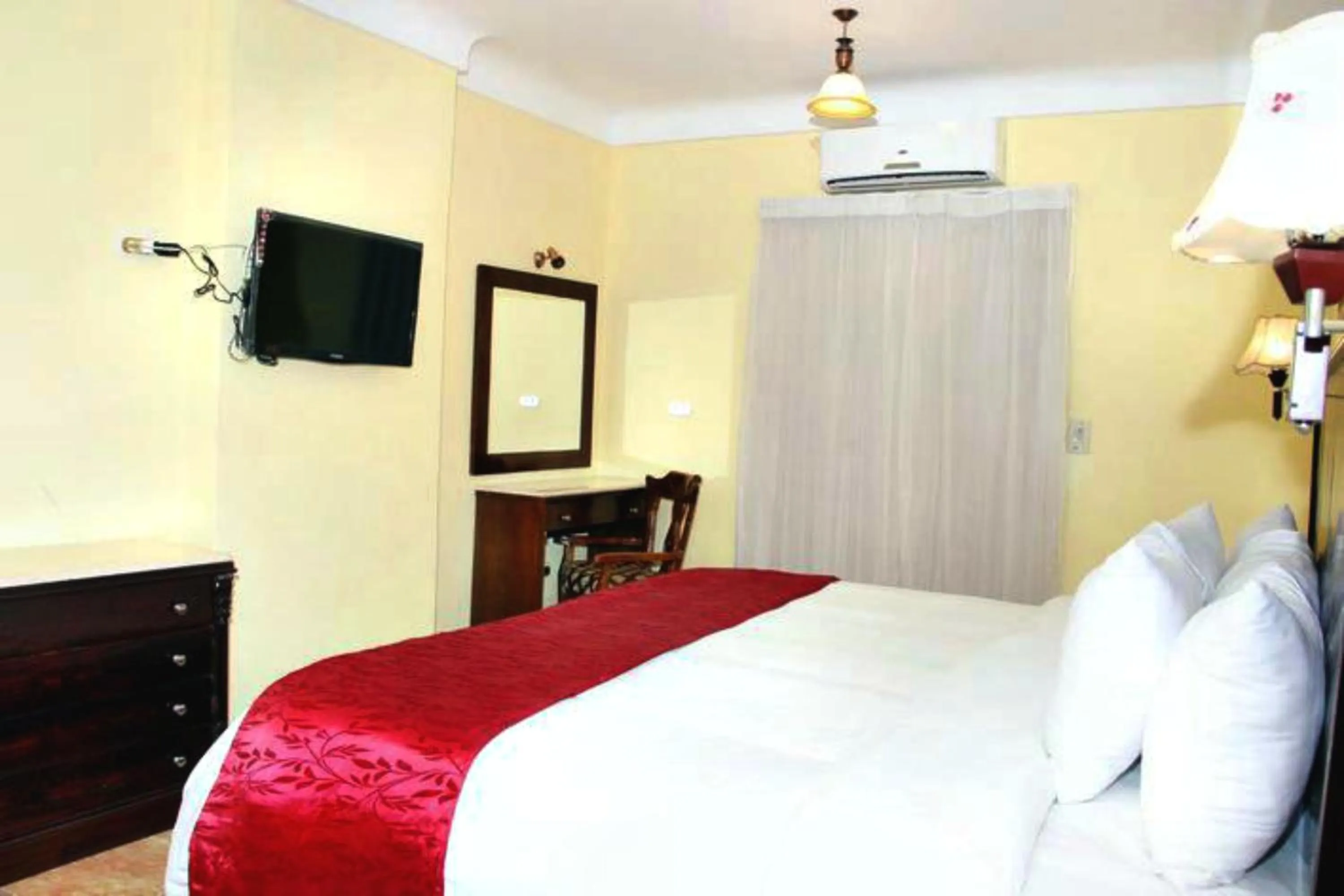 Bed in Alexandria Mediterranean Suites