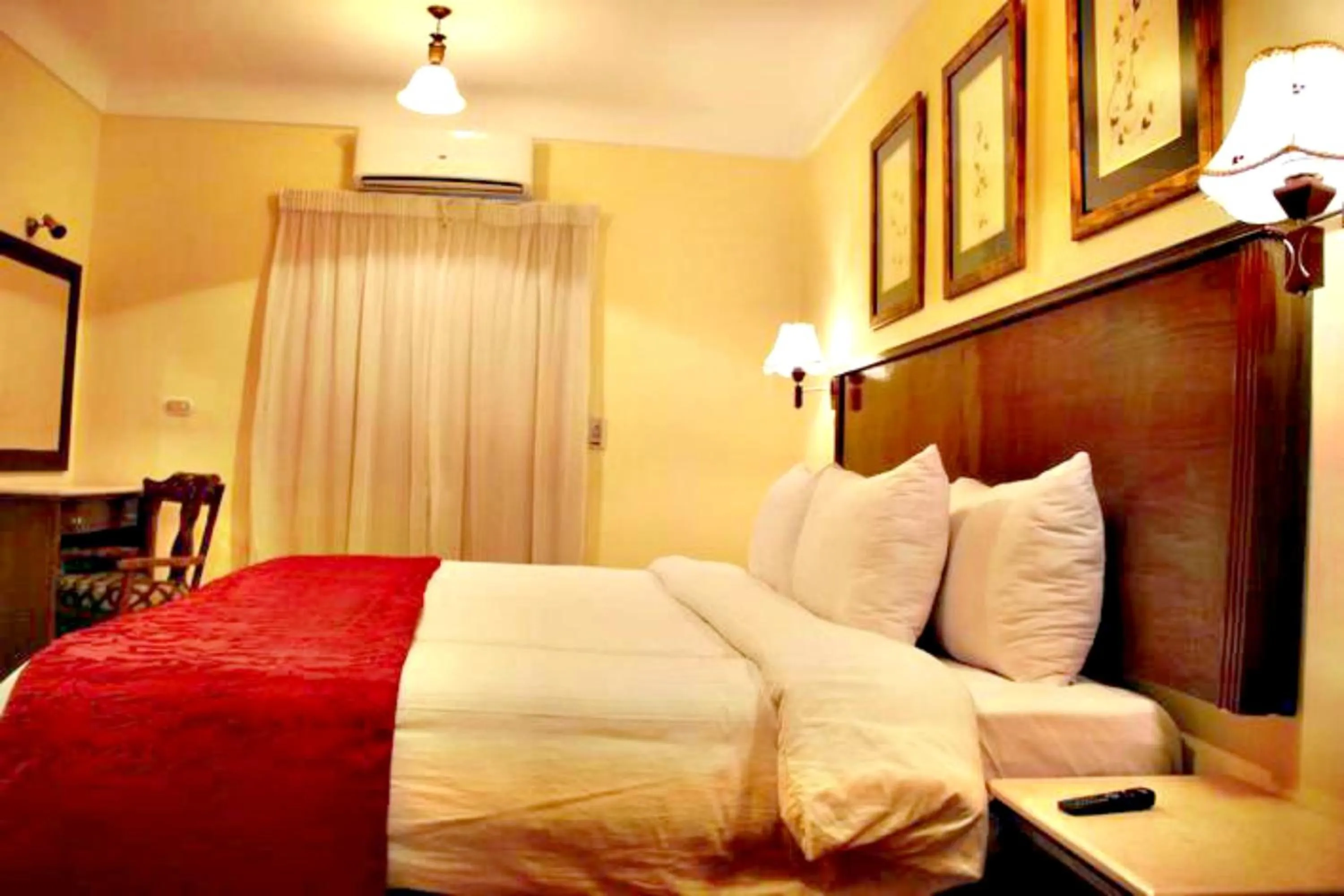 Bed in Alexandria Mediterranean Suites