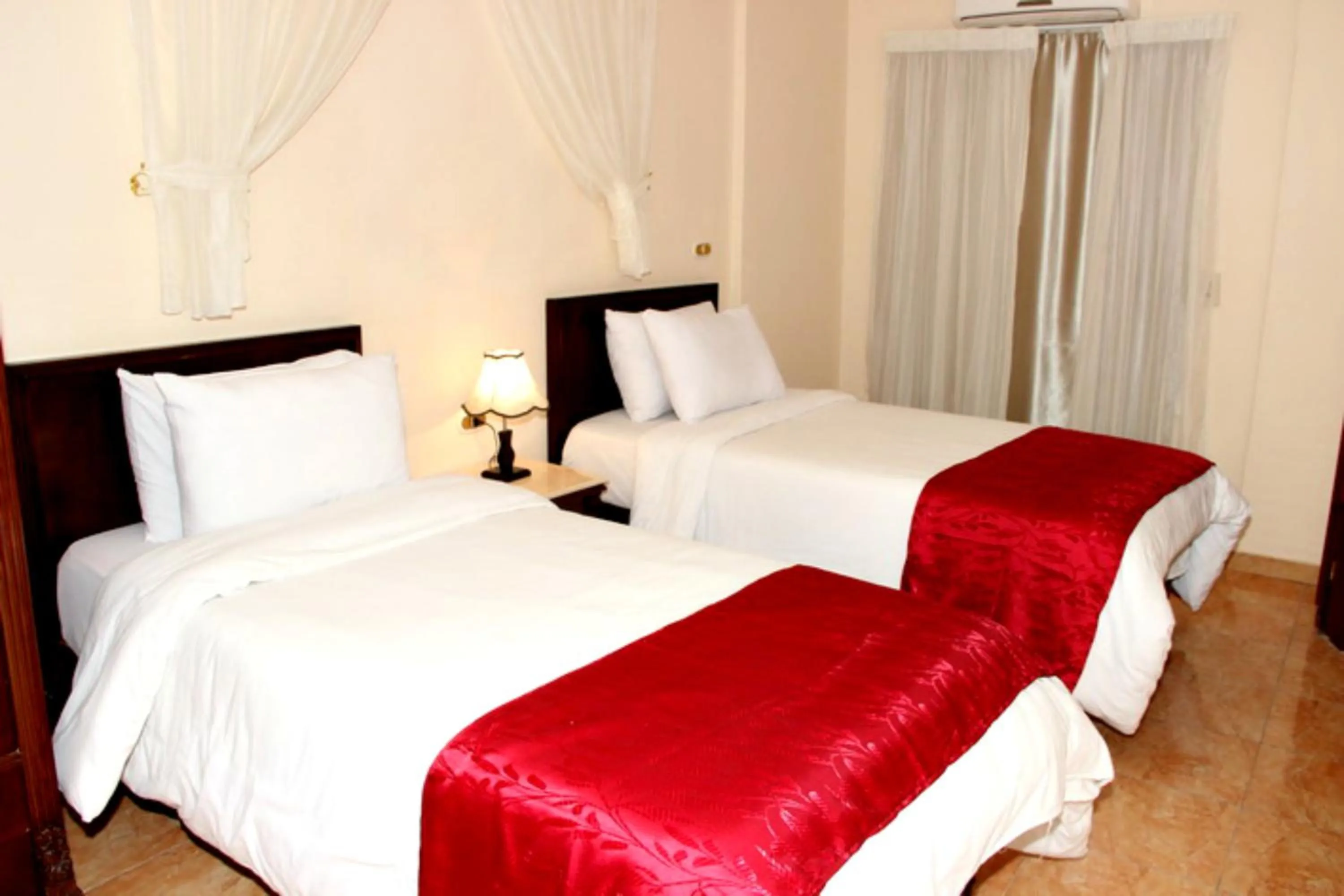 Bed in Alexandria Mediterranean Suites