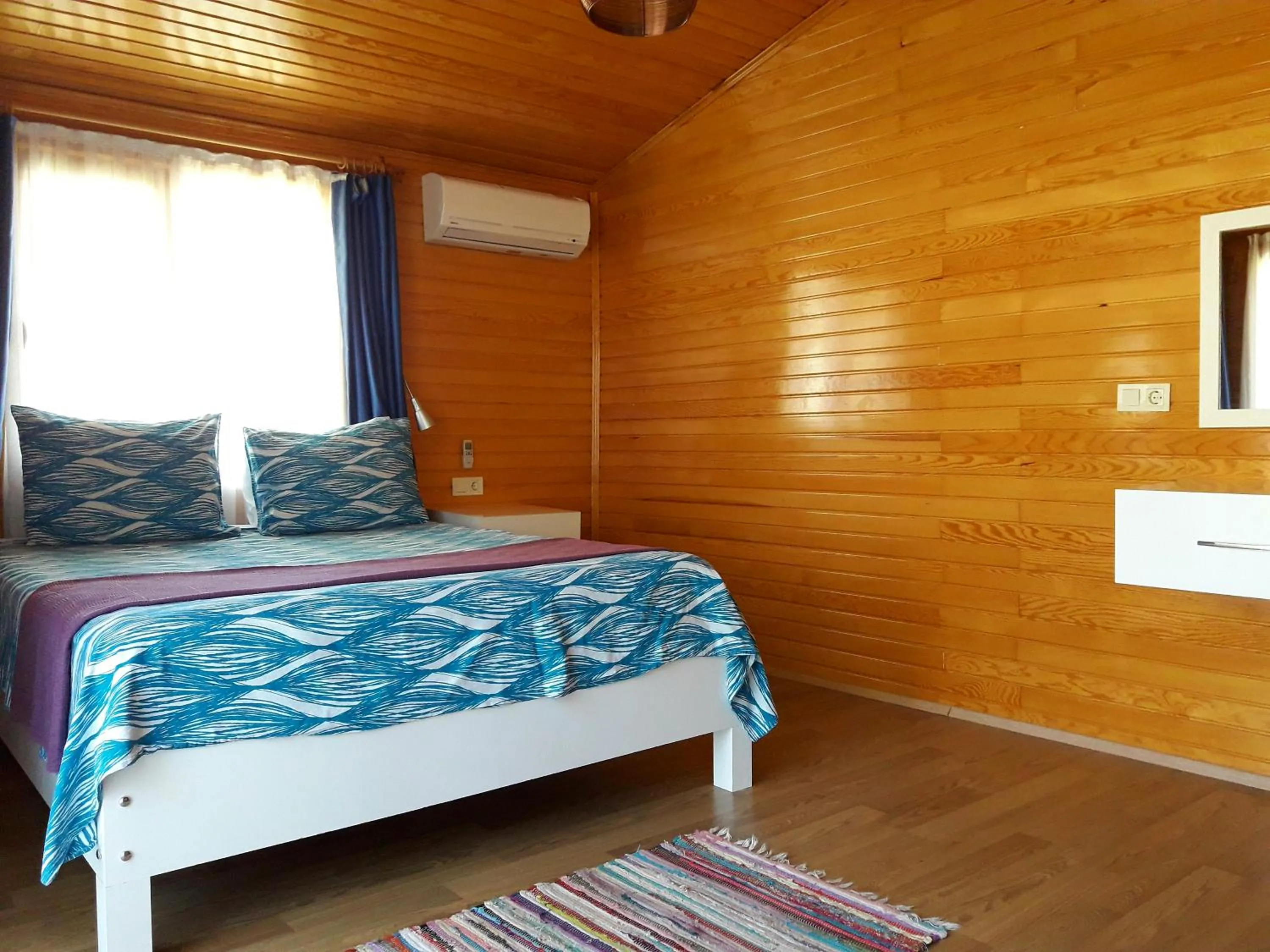 Bed in Sunset Boutique Hotel & Apartments