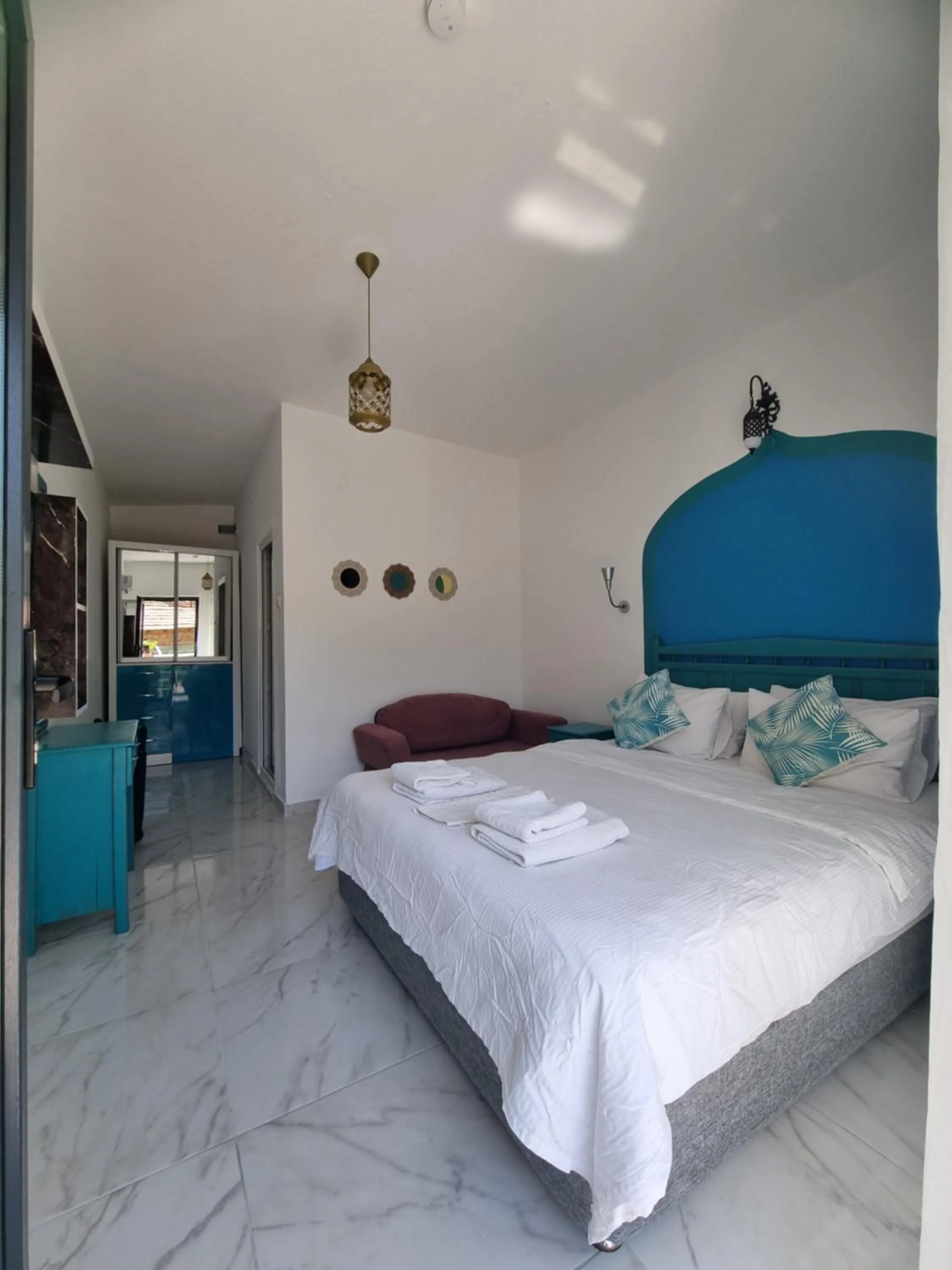 Bed in Sunset Boutique Hotel & Apartments