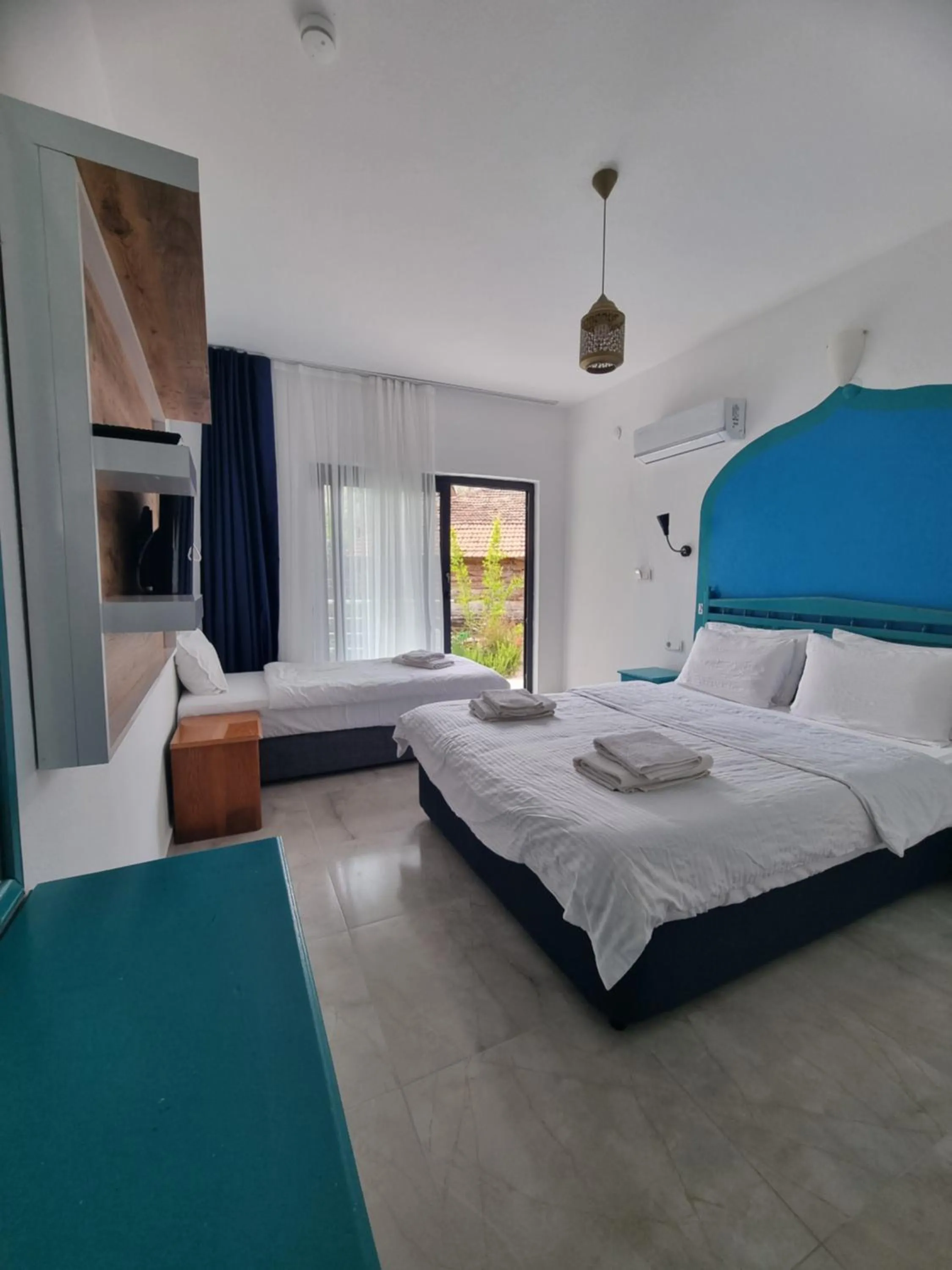 Bed in Sunset Boutique Hotel & Apartments