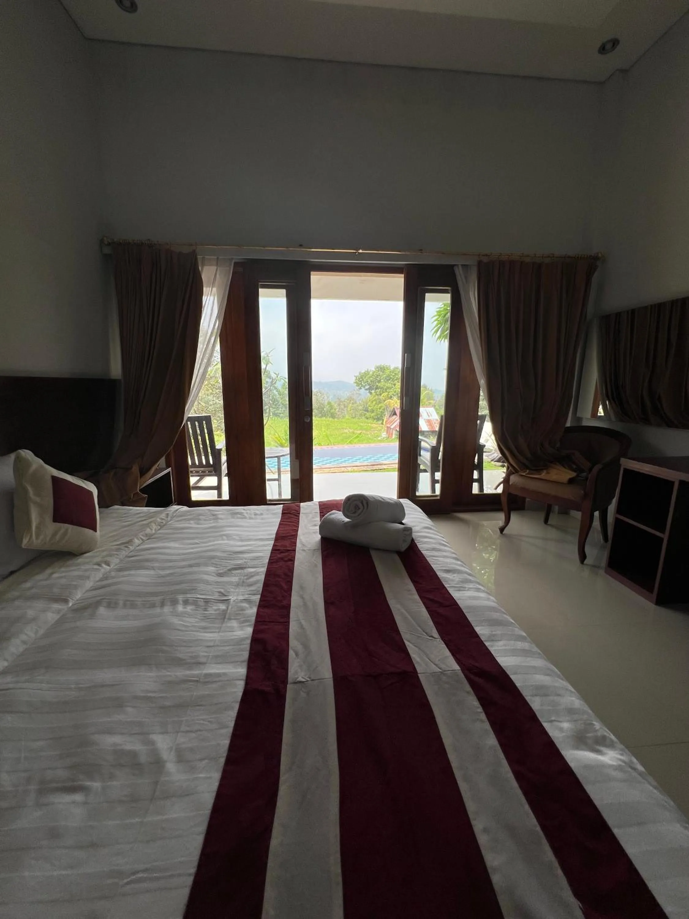 Bed in Mandhasativa Homestay