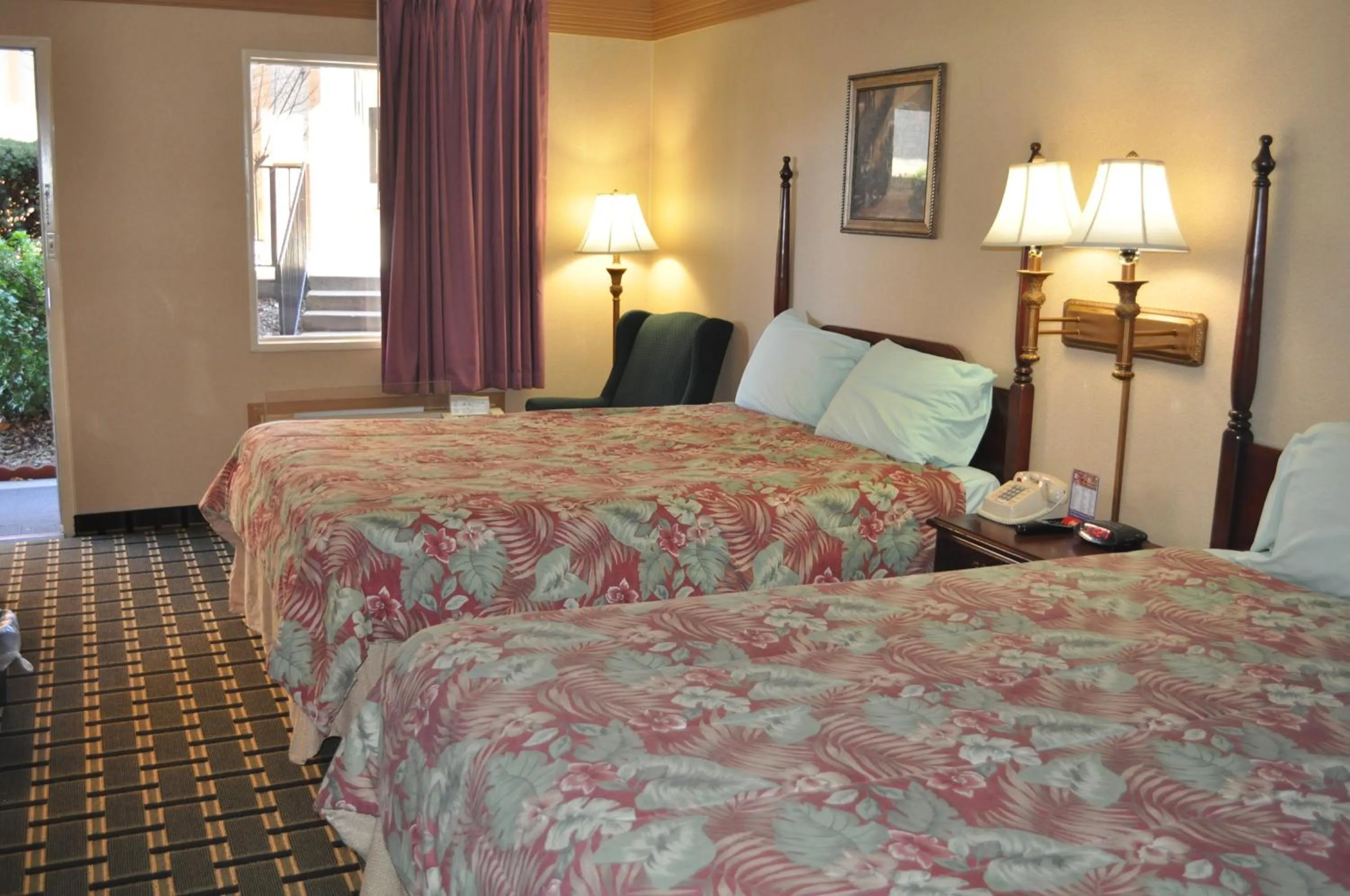 Bed in Executive Inn and Suites Springdale