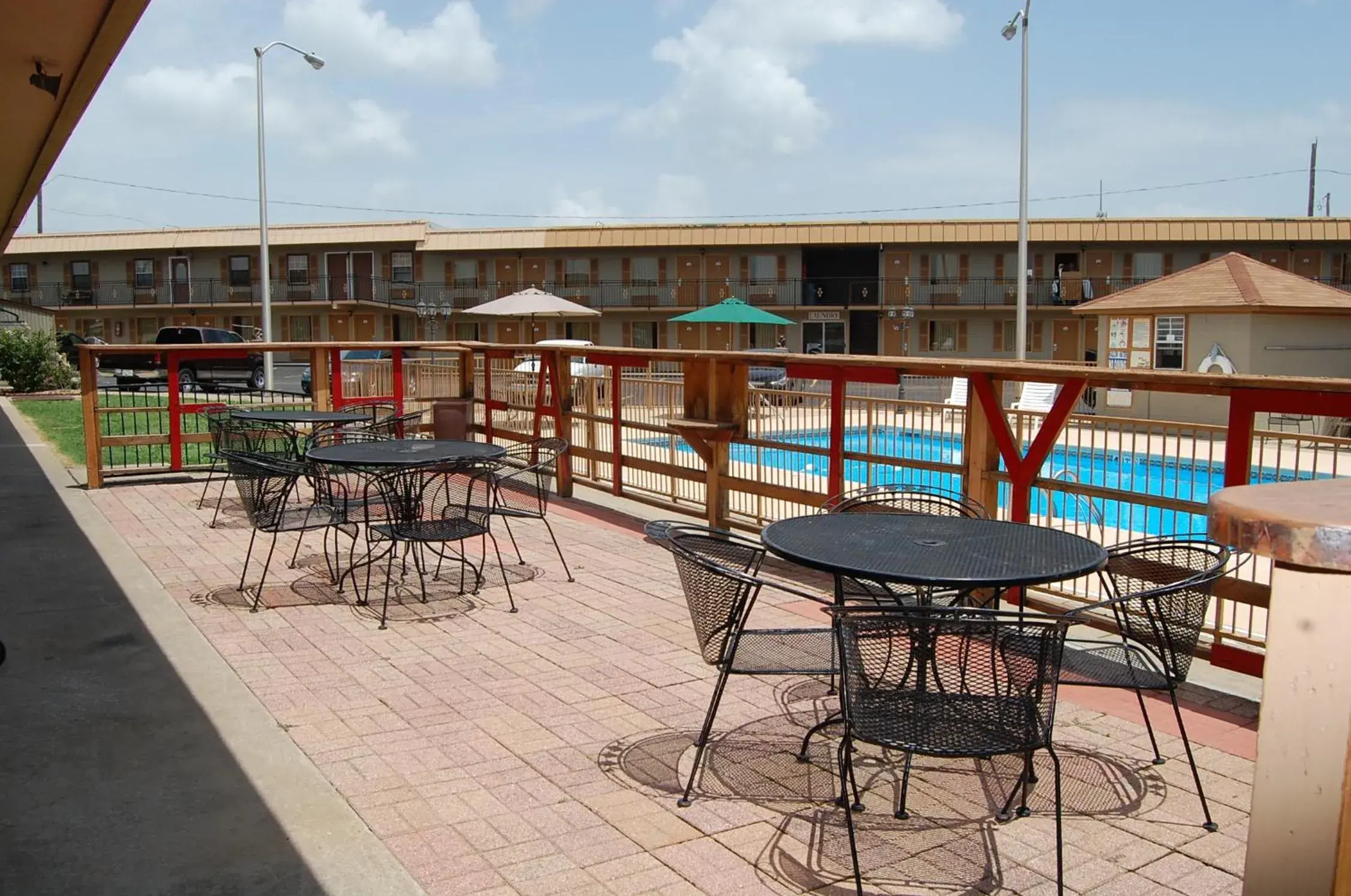 Patio, Pool View in Executive Inn and Suites Springdale