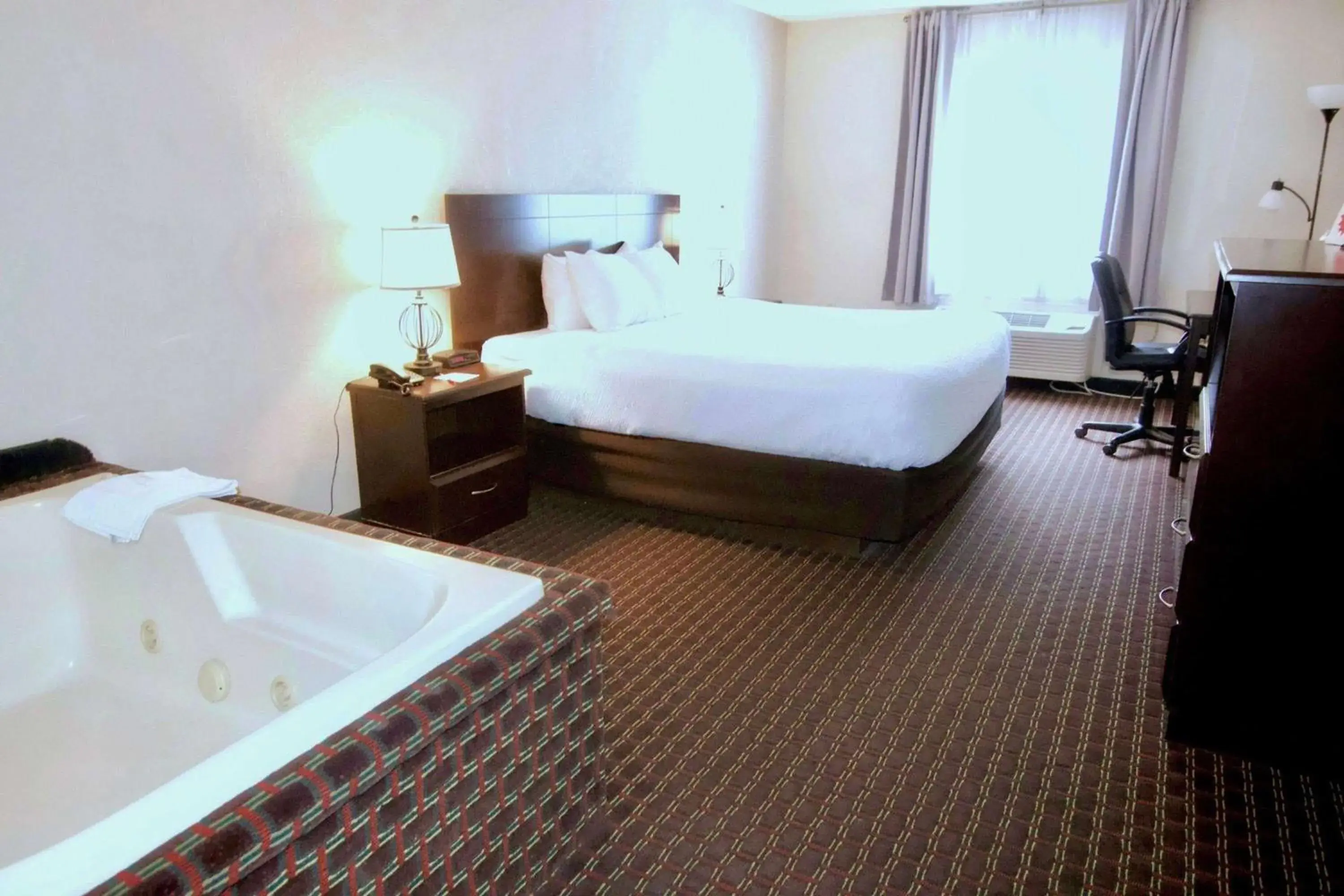 Photo of the whole room, Bed in Ramada by Wyndham Tell City Photo of the whole room, Bed in Ramada by Wyndham Tell City