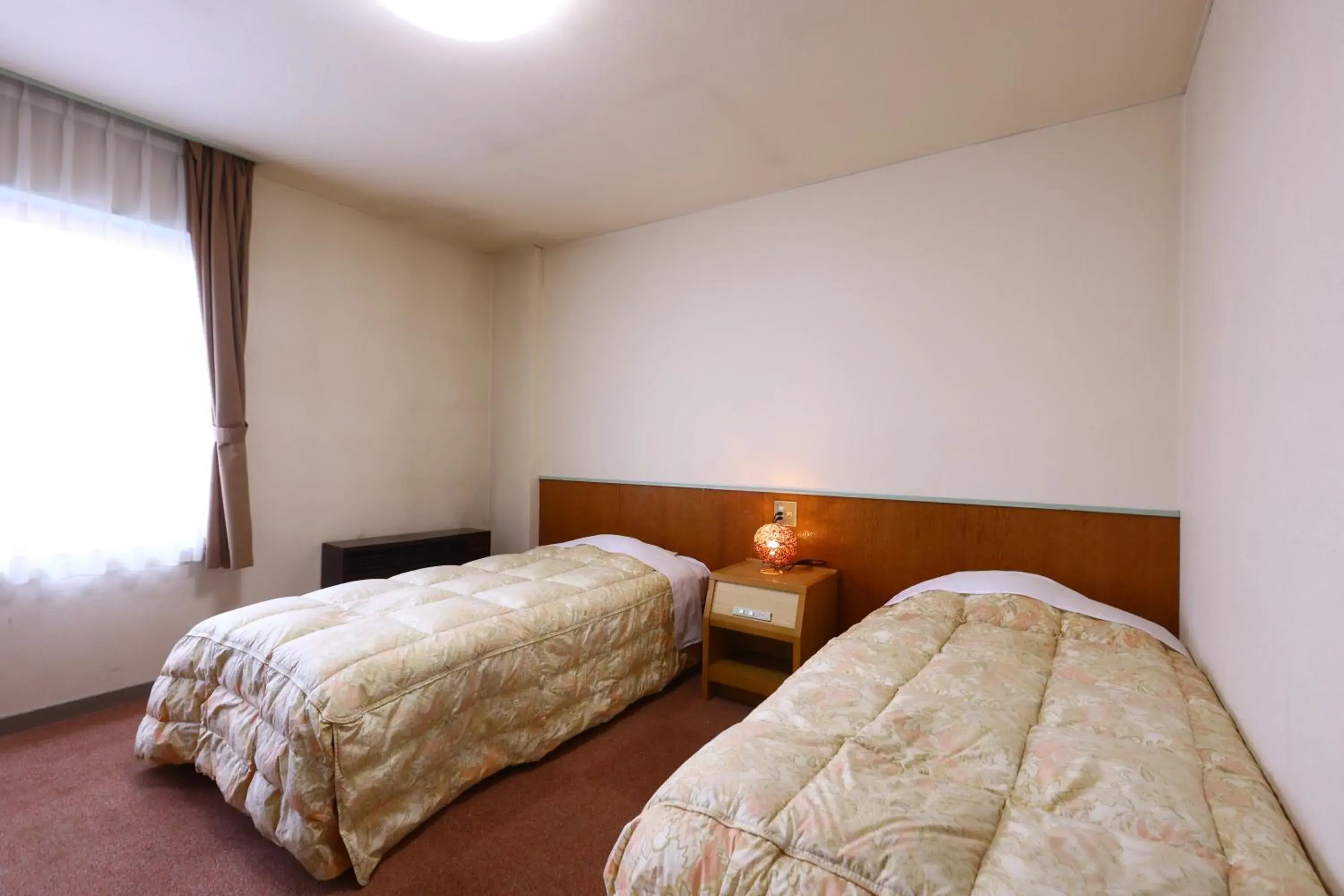 Bed in Hotel Sunplaza Tsugaike Bed in Hotel Sunplaza Tsugaike