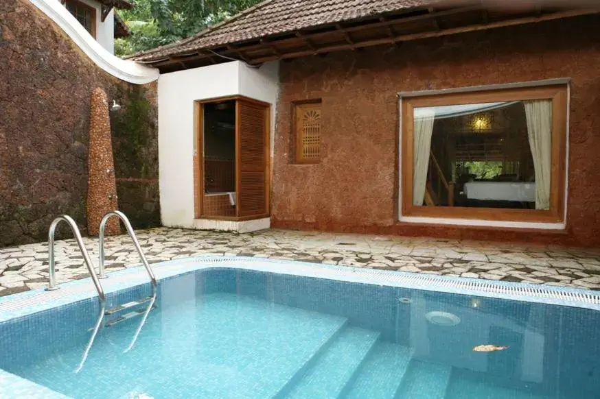 Swimming pool in The Leela Ashtamudi, A Raviz Hotel Swimming pool in The Leela Ashtamudi, A Raviz Hotel