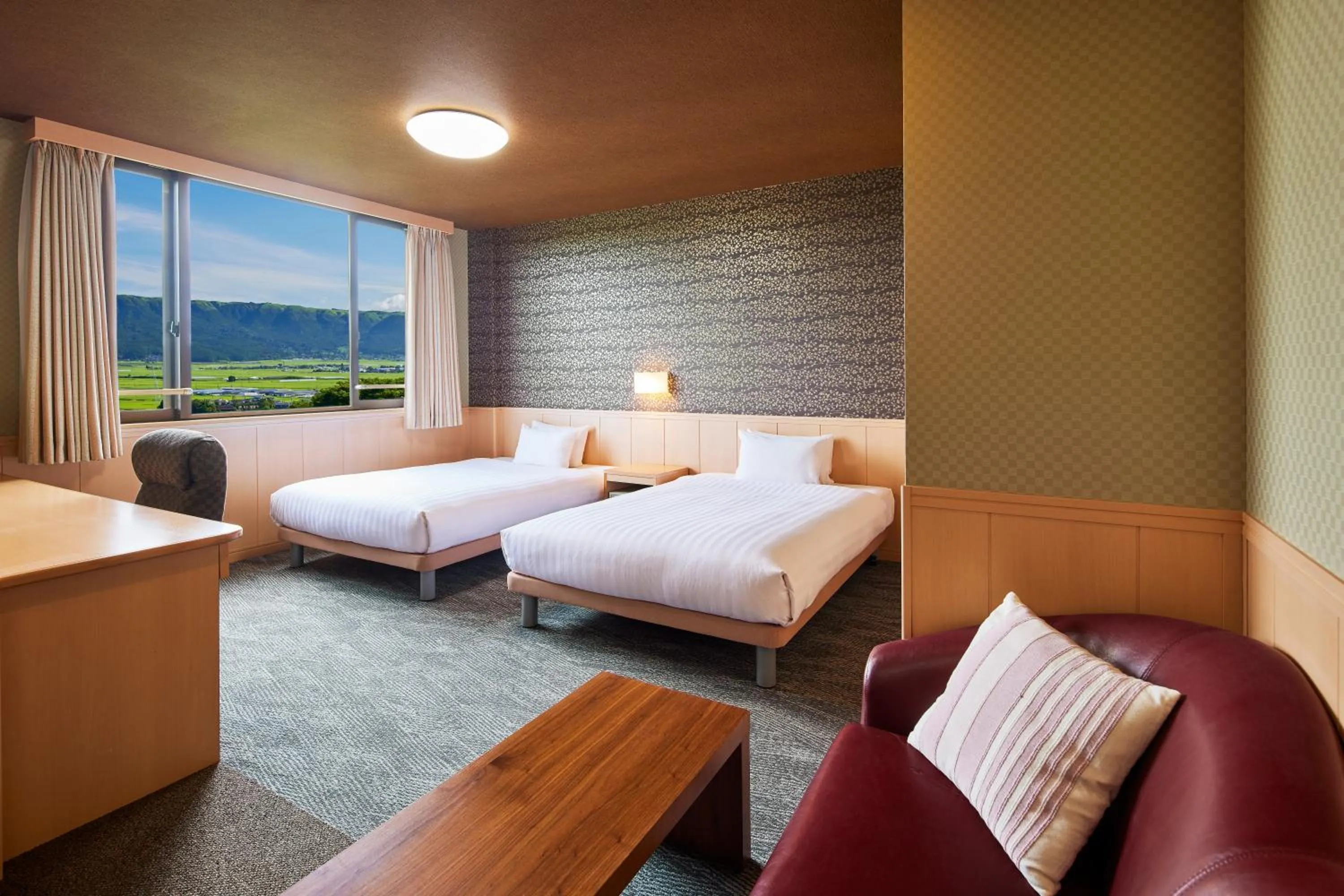 Living room, Bed in Kamenoi Hotel Aso Park Resort