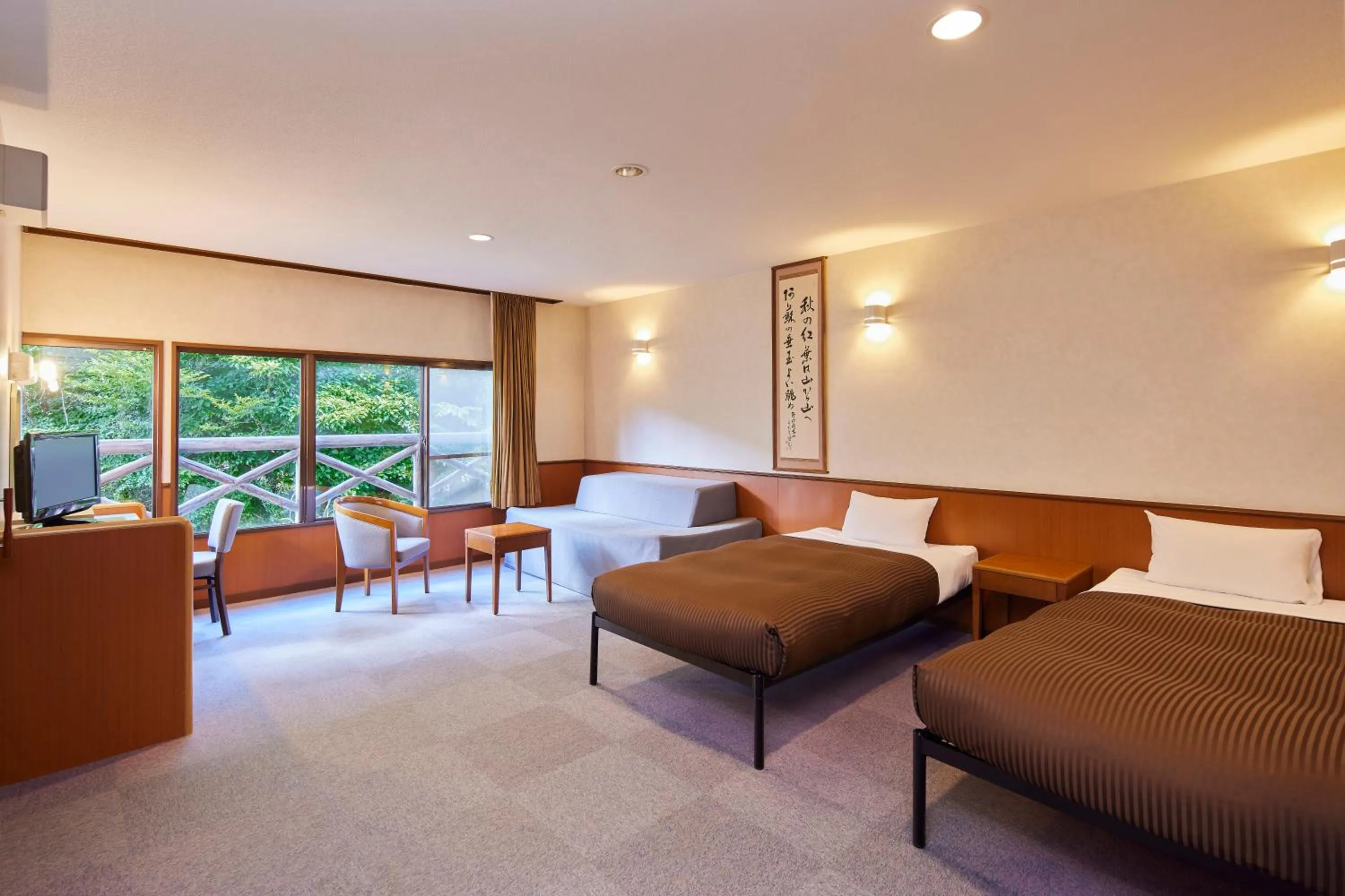 Living room, Bed in Kamenoi Hotel Aso Park Resort