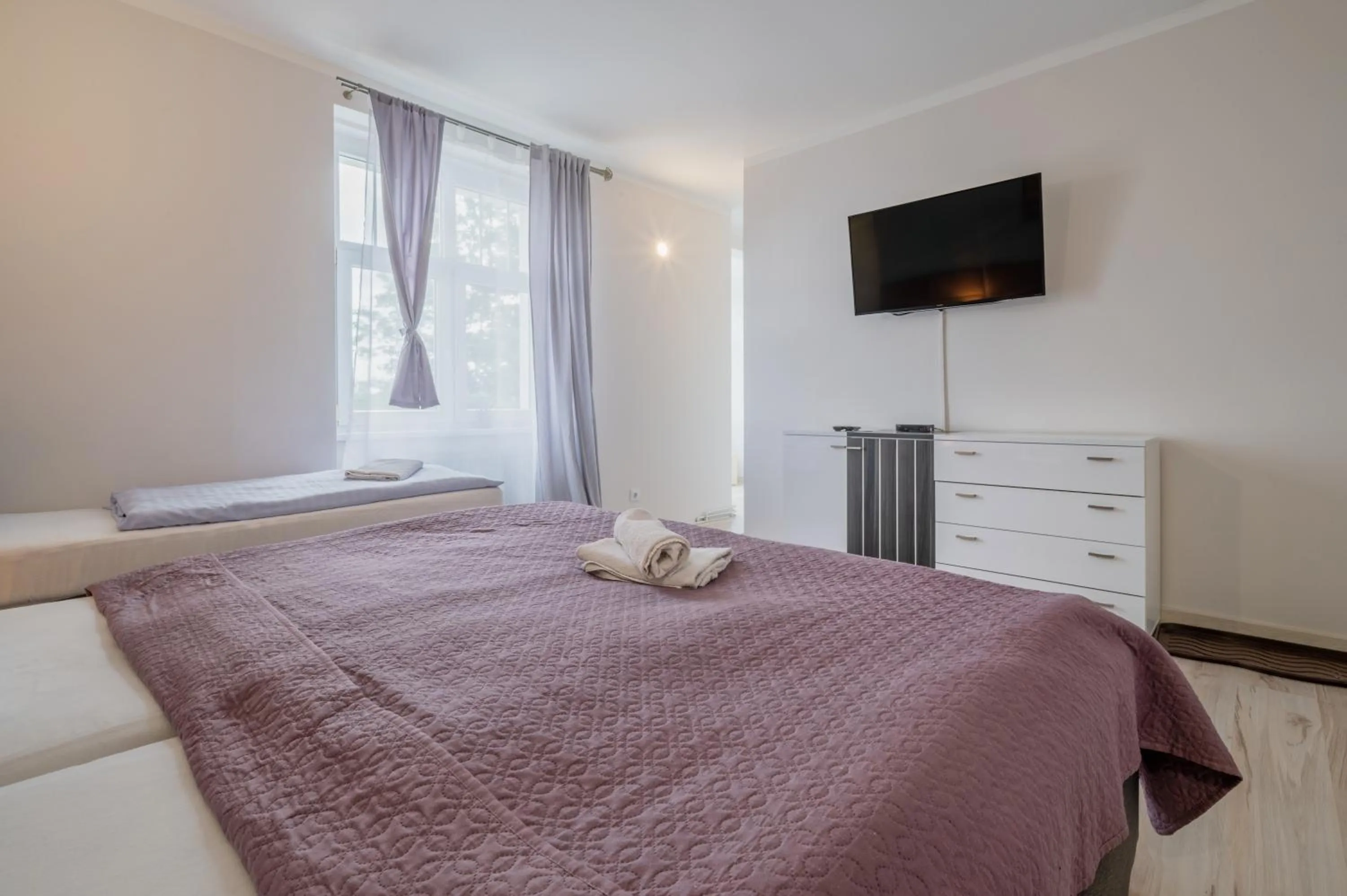 Communal lounge/ TV room, Bed in Lawendowy Dworek