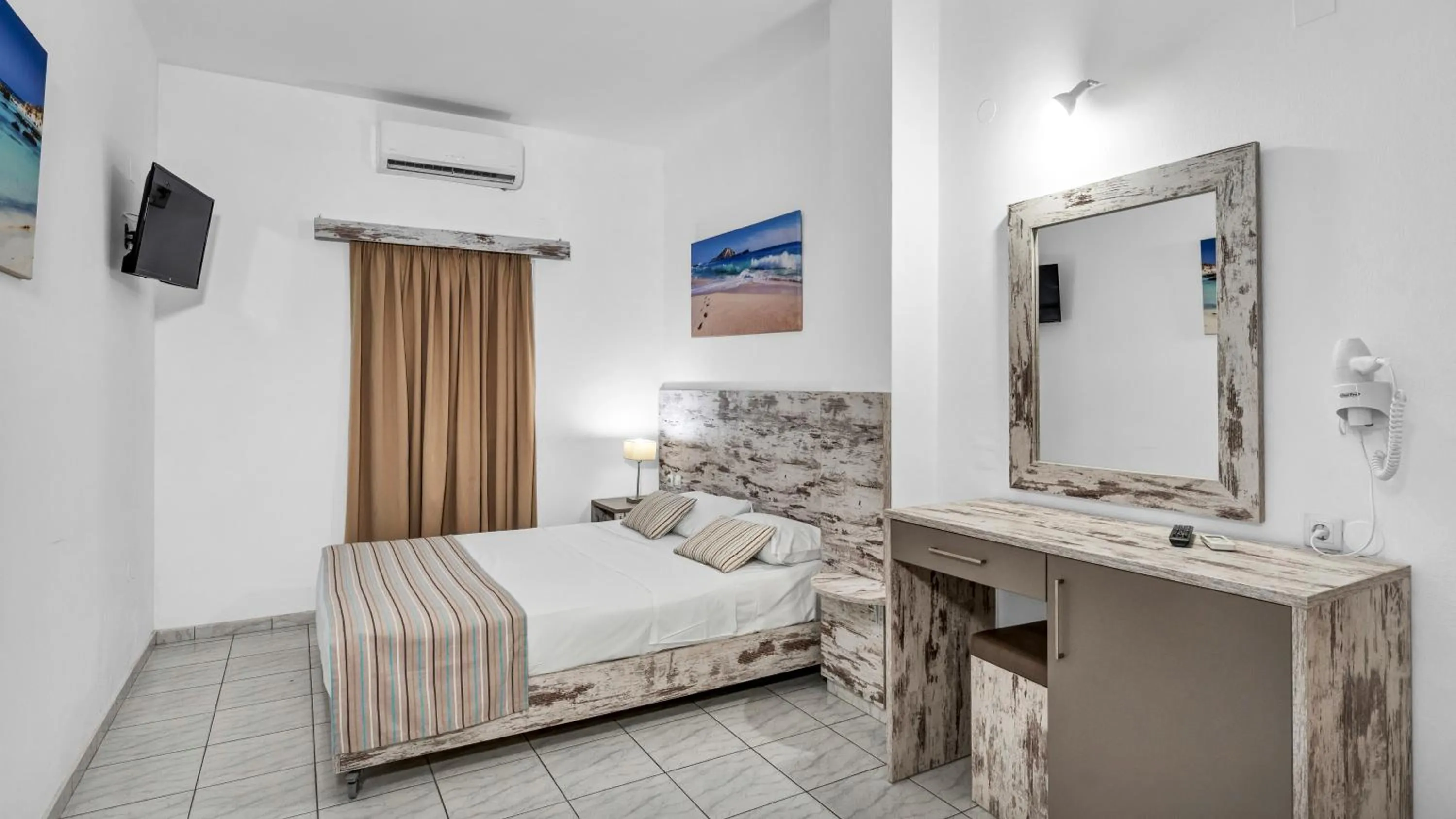 Bed in Evina Rooms & Suites