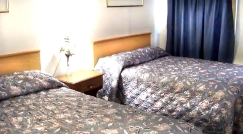 Bed in Monticello Inn - Monticello, Indiana