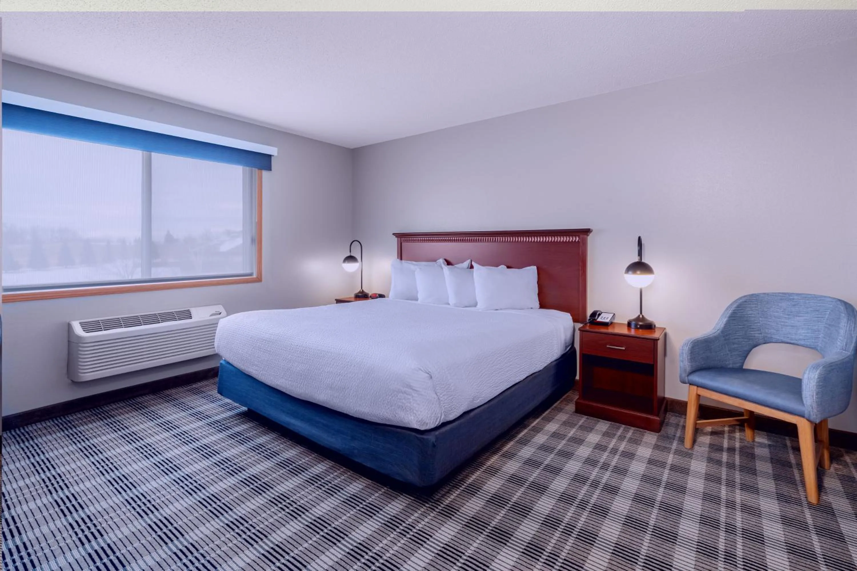Bed in AmericInn by Wyndham Valley City Conference Center