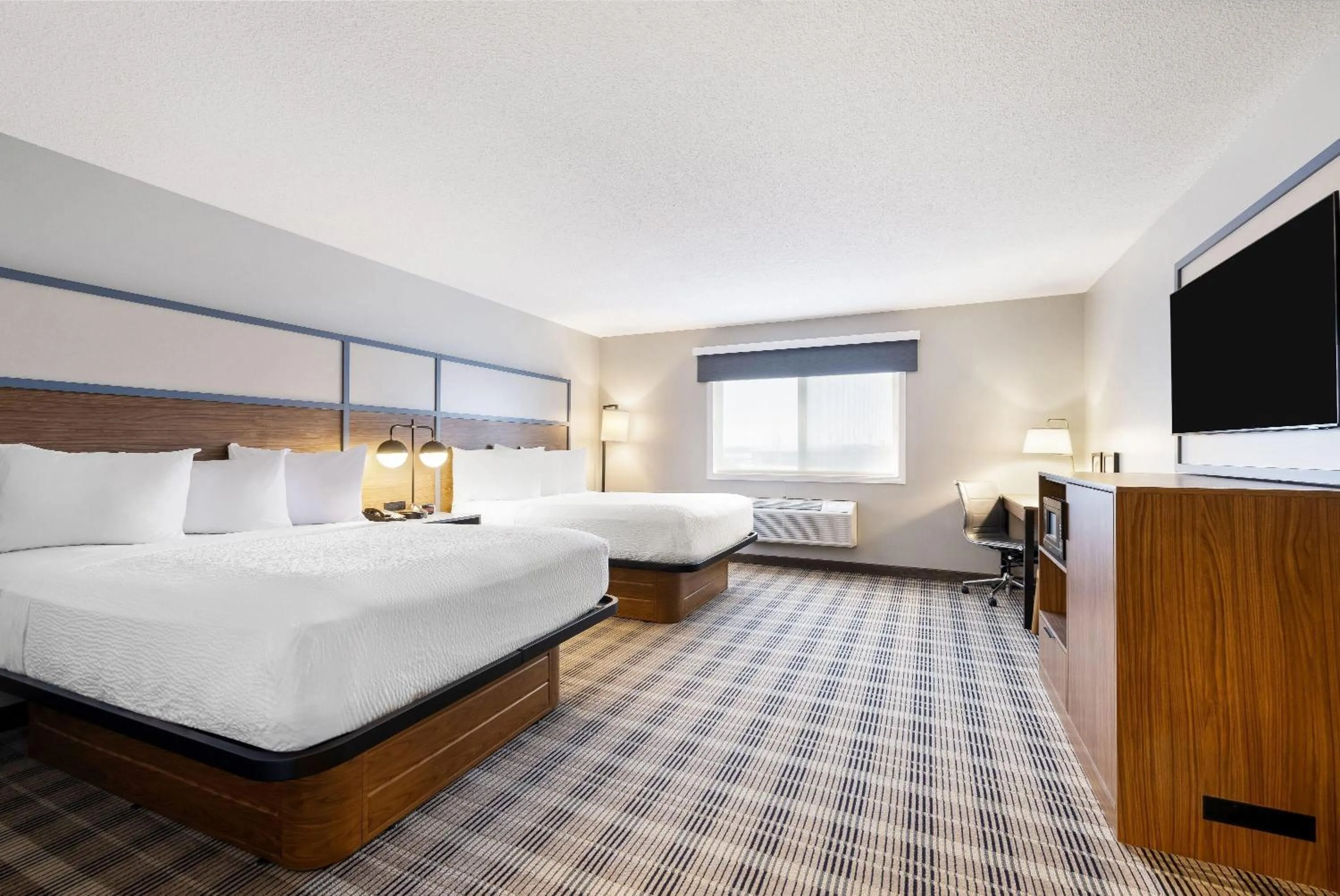 Bed in AmericInn by Wyndham Valley City Conference Center