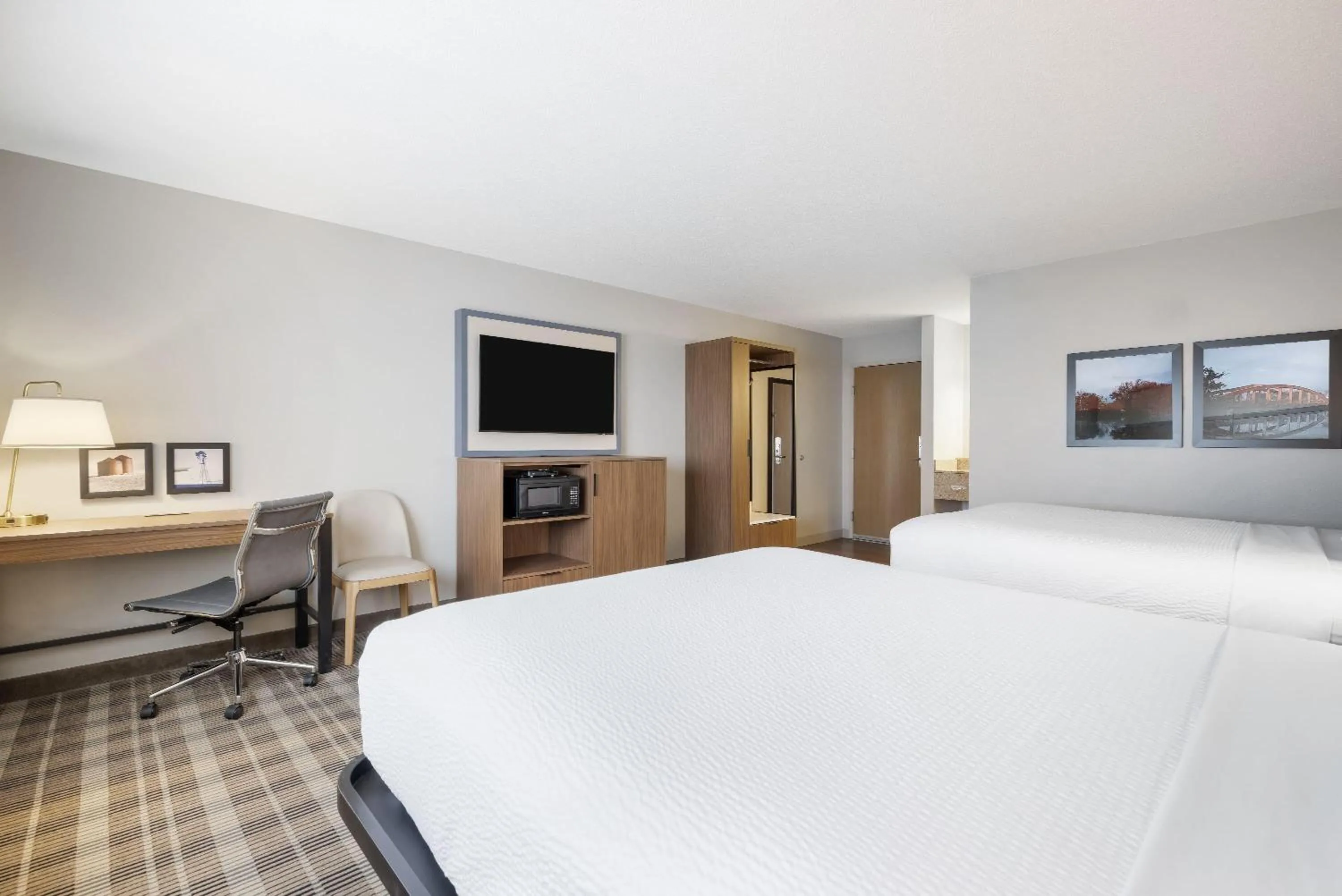 Bed in AmericInn by Wyndham Valley City Conference Center