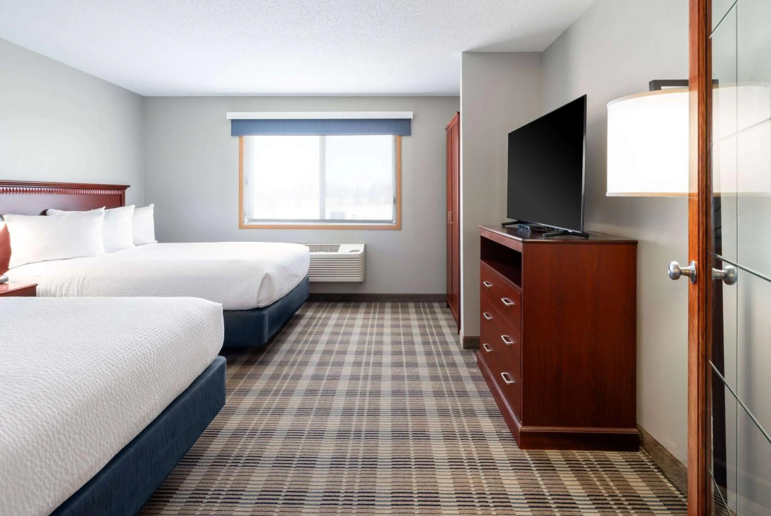 Photo of the whole room, Bed in AmericInn by Wyndham Valley City Conference Center