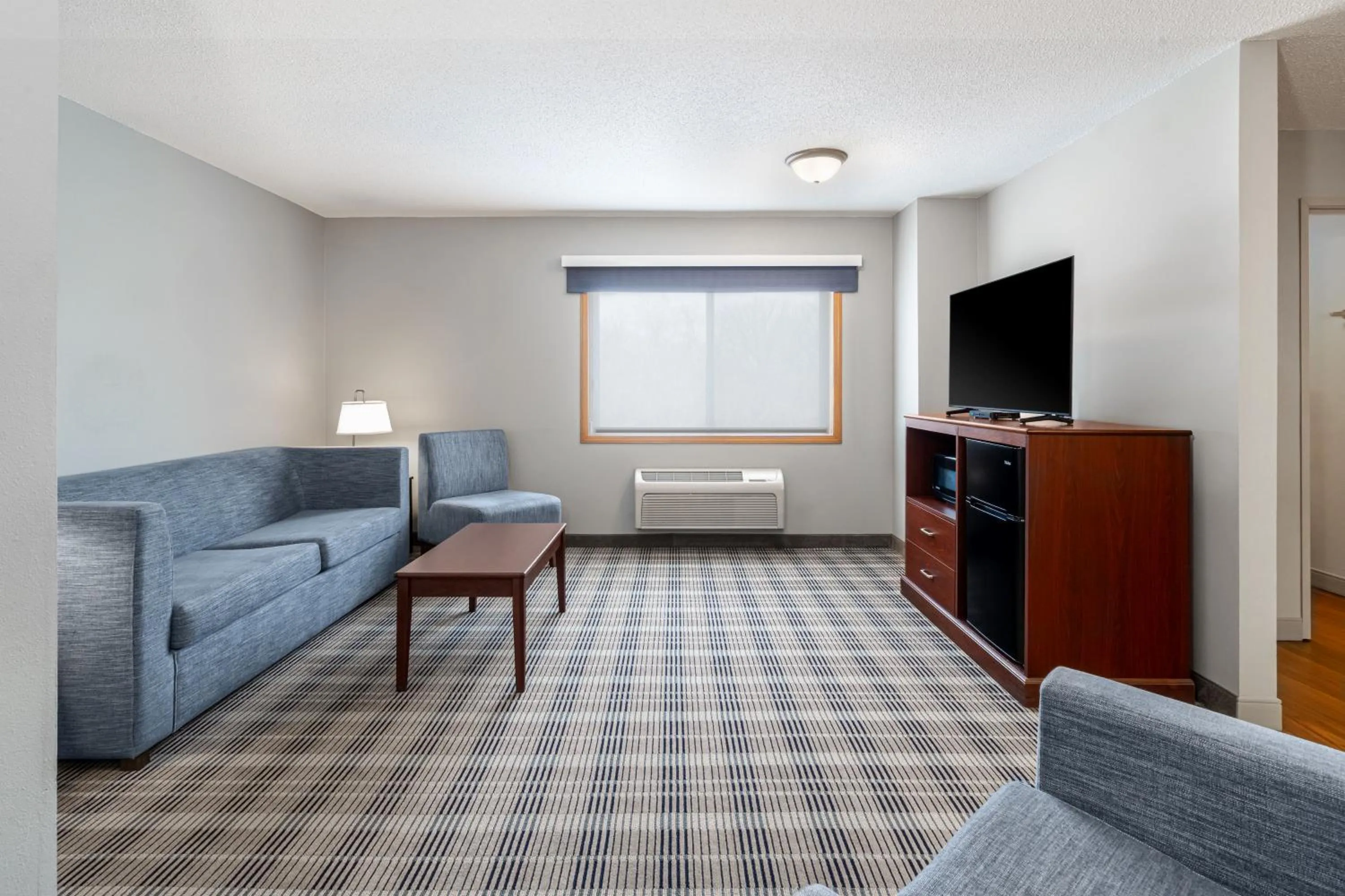 Living room in AmericInn by Wyndham Valley City Conference Center
