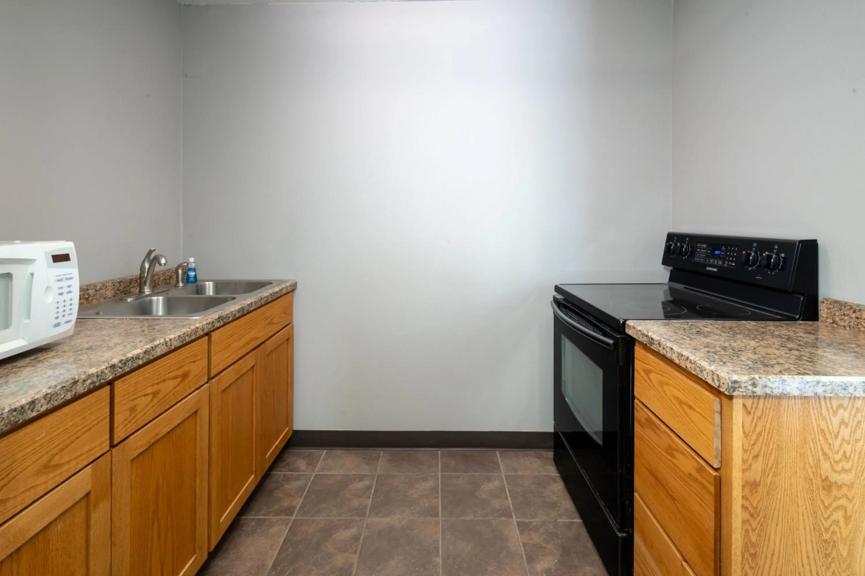 Communal kitchen in AmericInn by Wyndham Valley City Conference Center