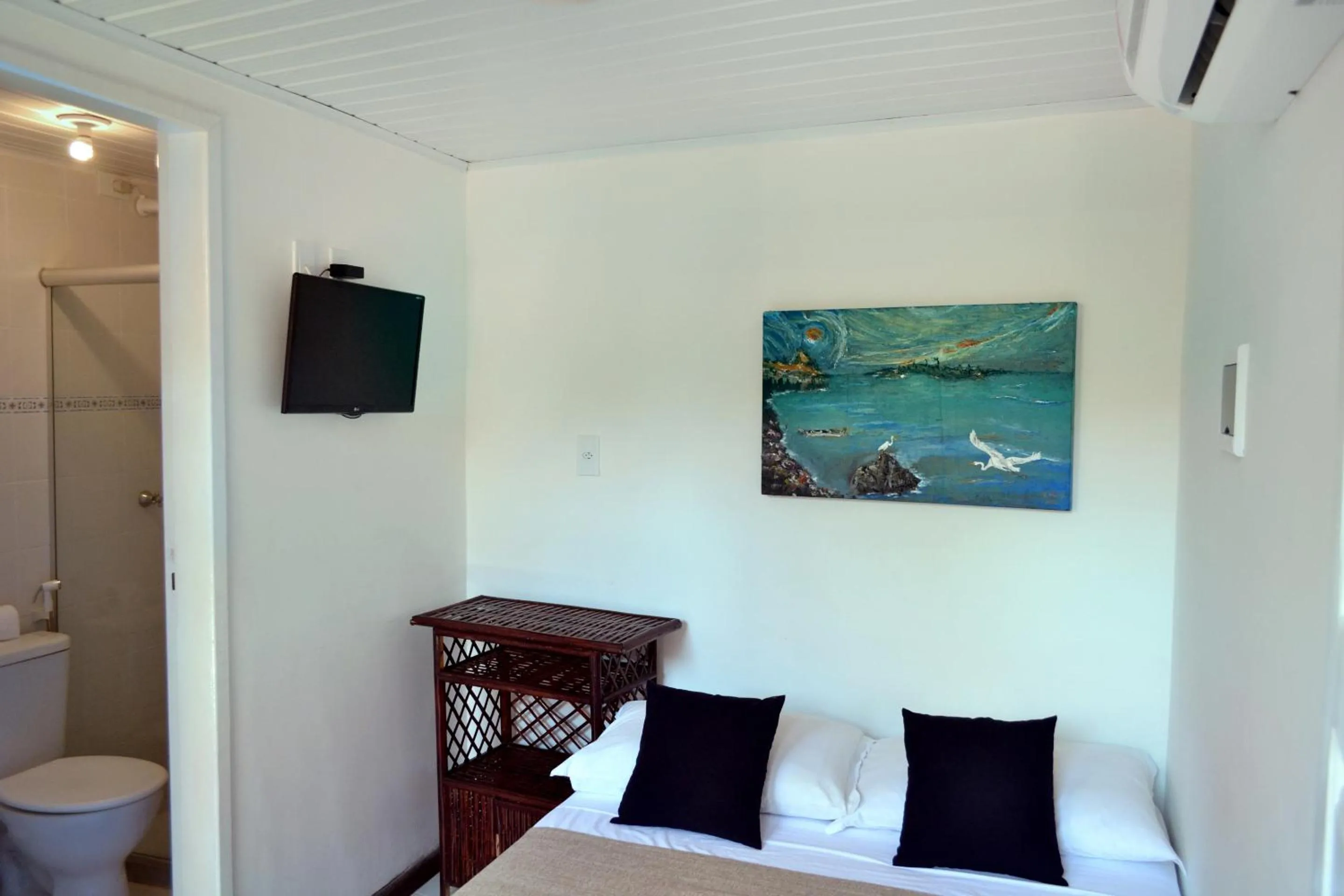 Bed in Pousada Aconchego