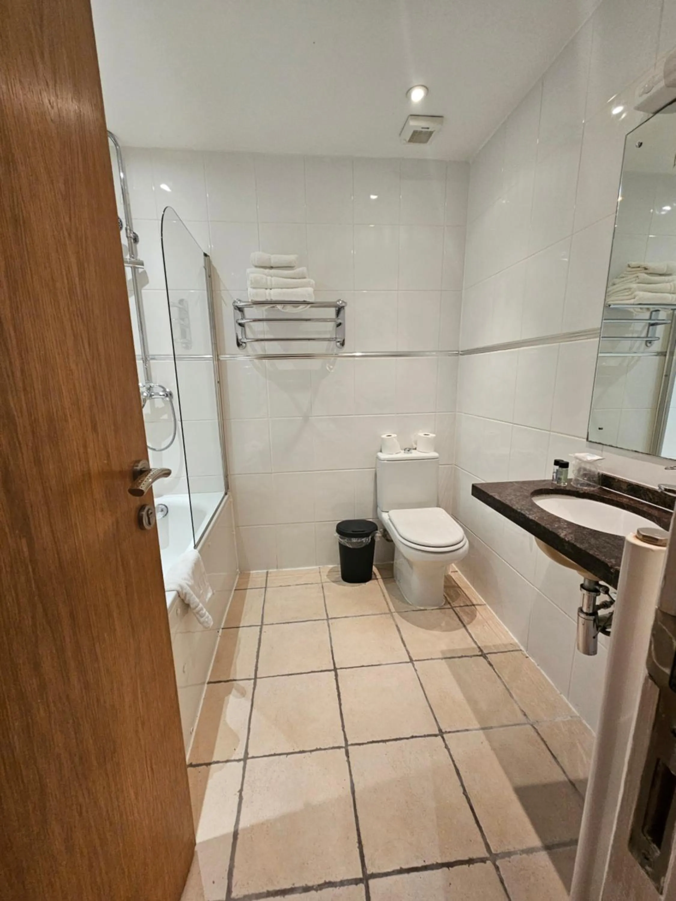 Bathroom in OYO The Luton Hotel