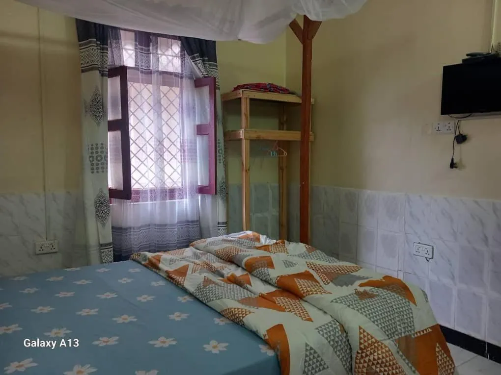 Photo of the whole room, Bed in Rafiki Apartment