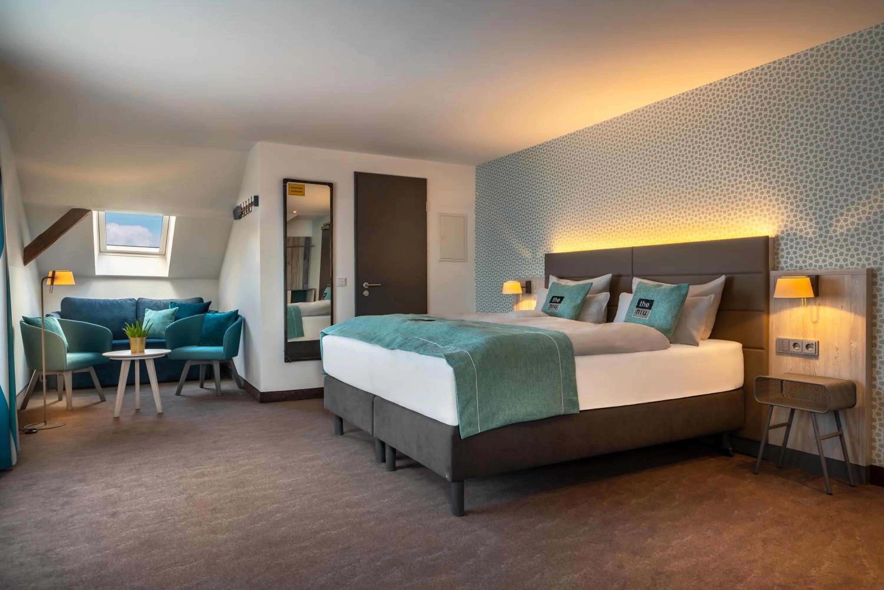 Living room, Bed in Holiday Inn - the niu, Rig Lübeck by IHG