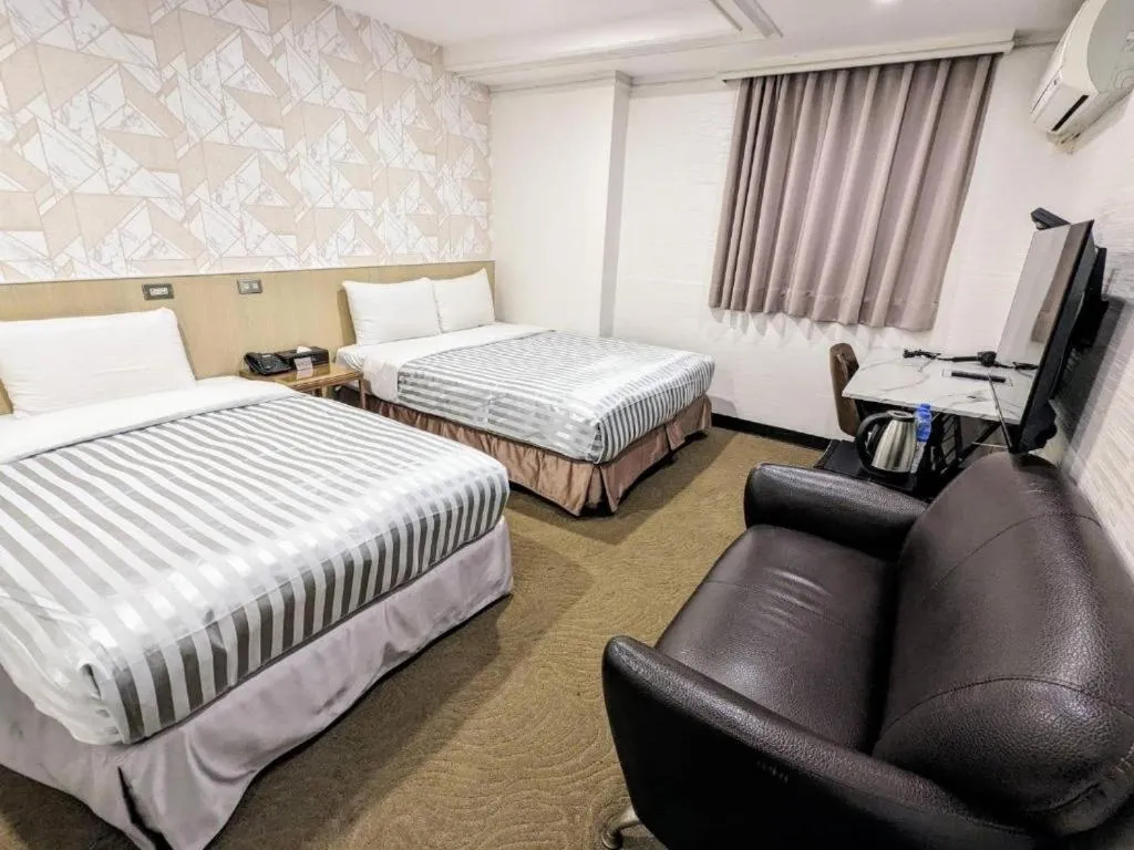 Bed in 西門大飯店 Ximen Hotel