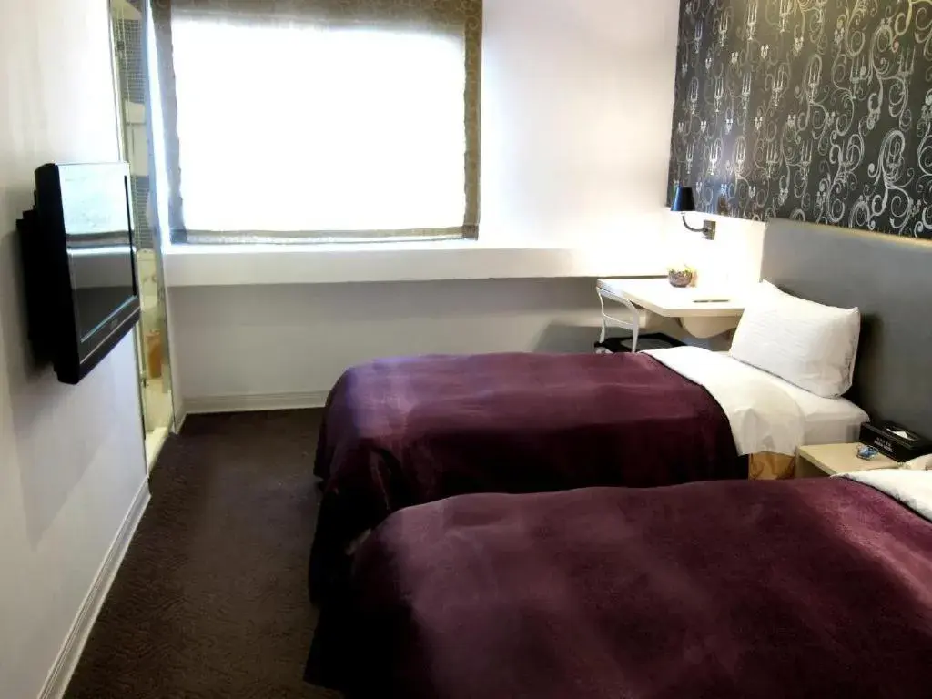 Bed in 西門大飯店 Ximen Hotel Bed in 西門大飯店 Ximen Hotel