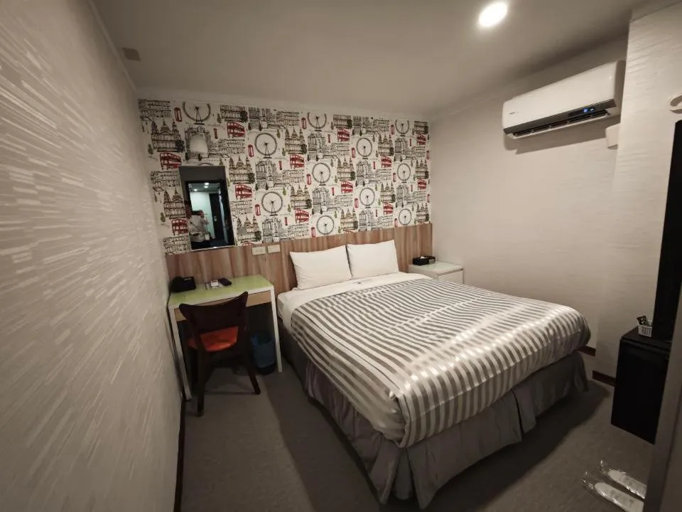 Bed in 西門大飯店 Ximen Hotel