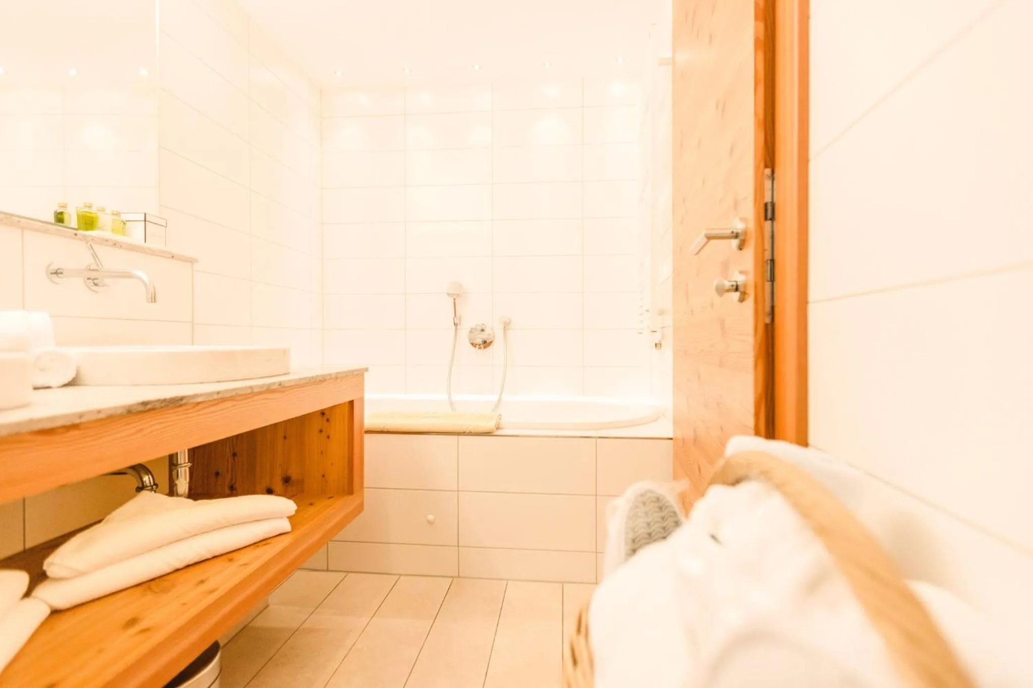 Bathroom, Bed in Hotel Glemmtalerhof