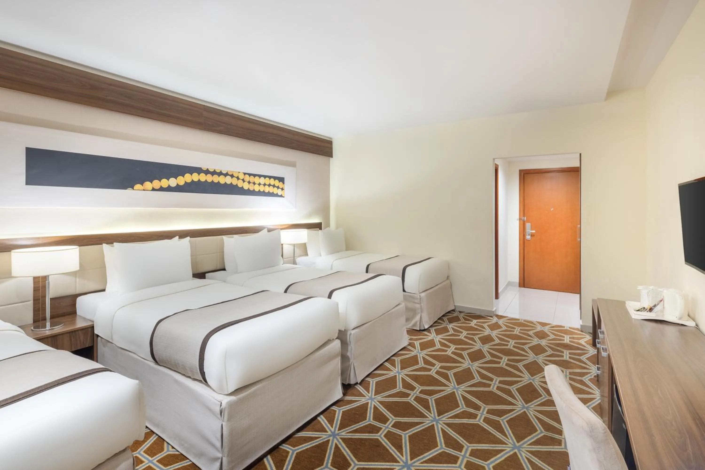 Communal lounge/ TV room, Bed in Blue Coral Hotel