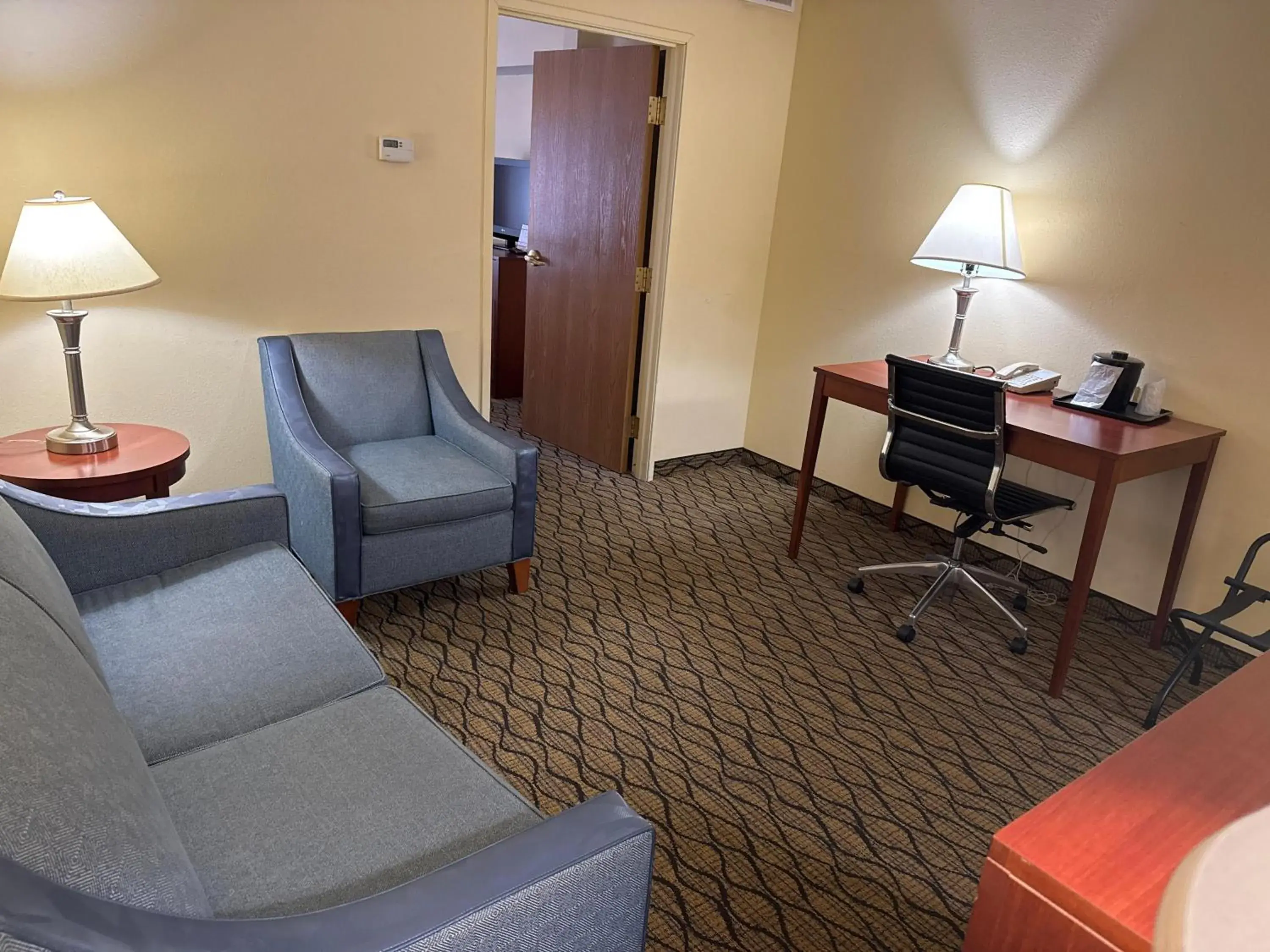 Living room in Baymont by Wyndham Mishawaka South Bend Area Living room in Baymont by Wyndham Mishawaka South Bend Area