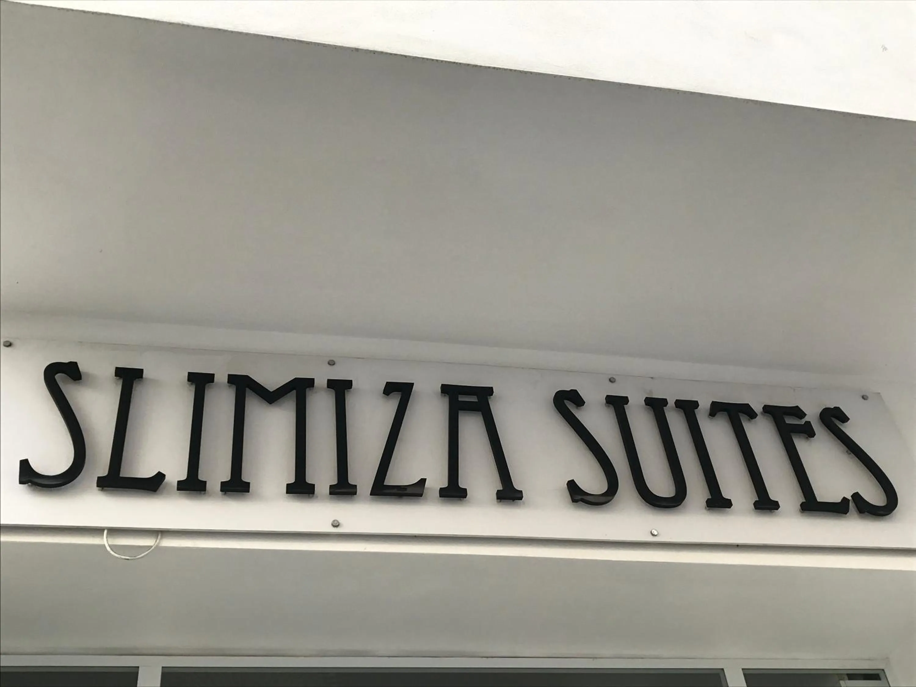 Property logo or sign in Slimiza Suites