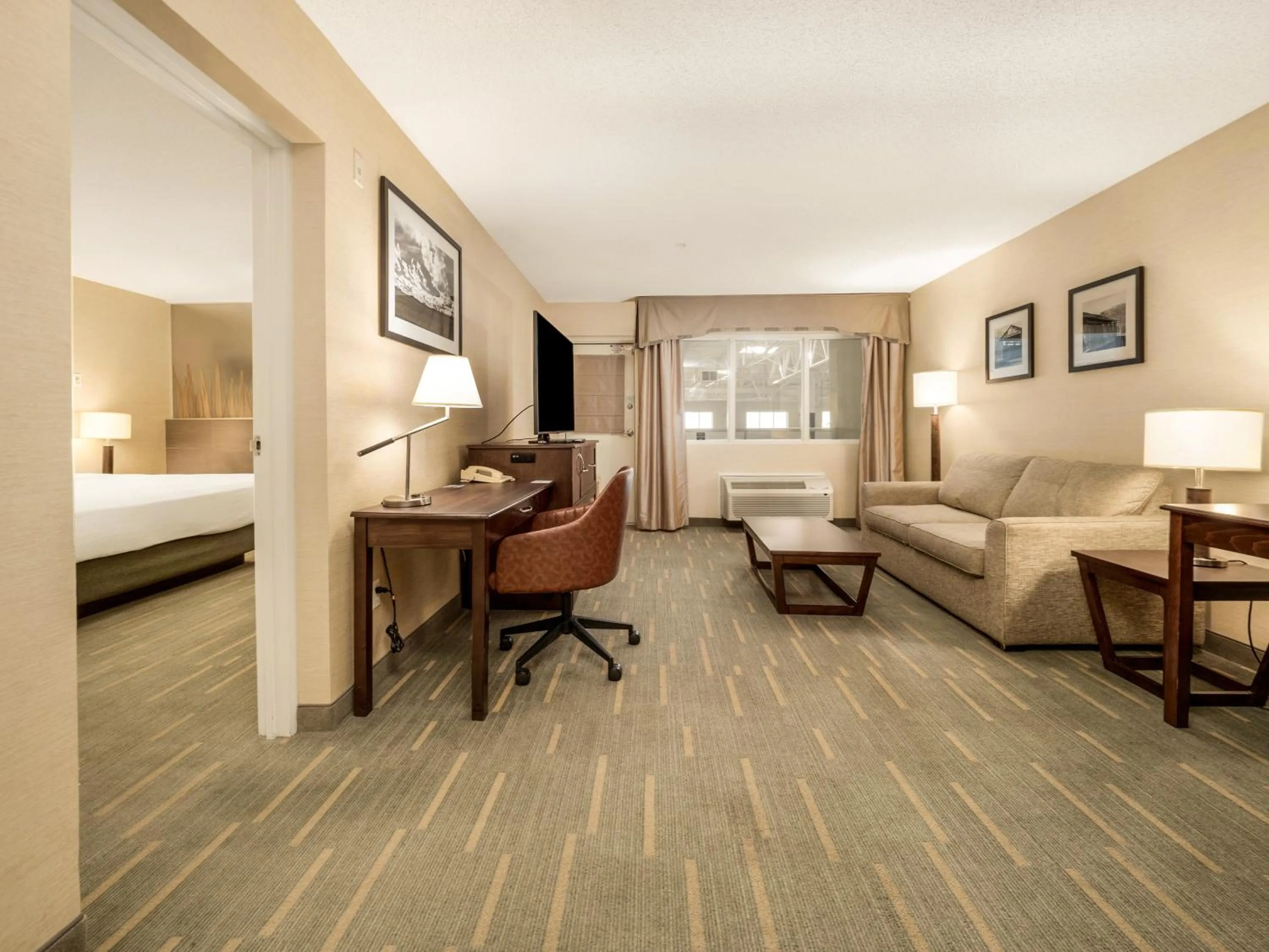 Living room, Bed in Holiday Inn Lethbridge by IHG
