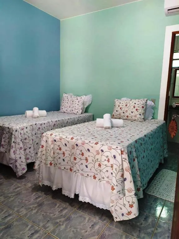 Bed in Pousada Nenzinha